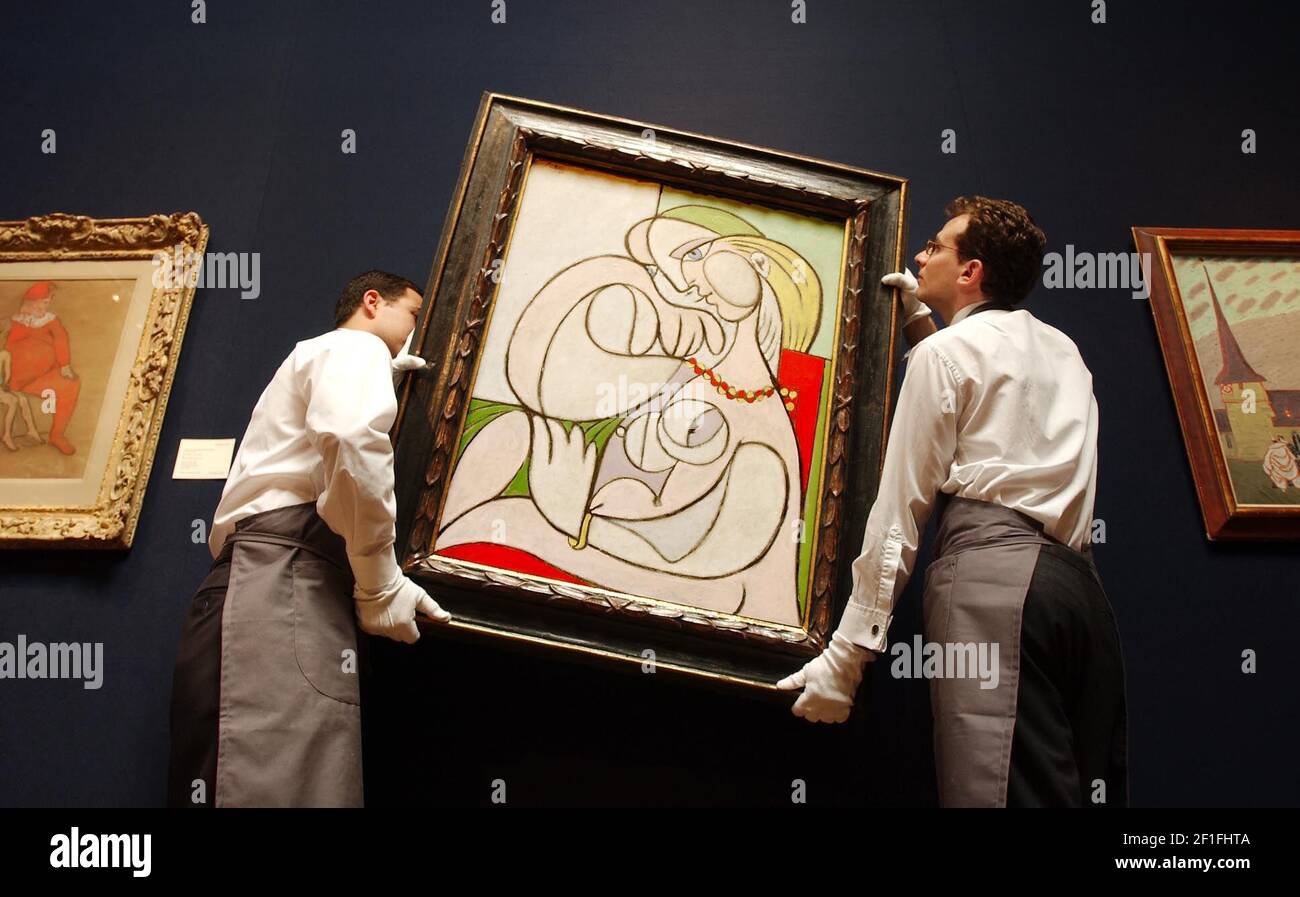 'Nu au collier', one of nine Picasso's being hung at Christies this morning as part of their 'Impressionist and Modern art' sale taking place on 25th June. Leading the sale, Picasso's work is expected to fetch ¿15-20 Million.21 June 2002 photo Andy Paradise Stock Photo