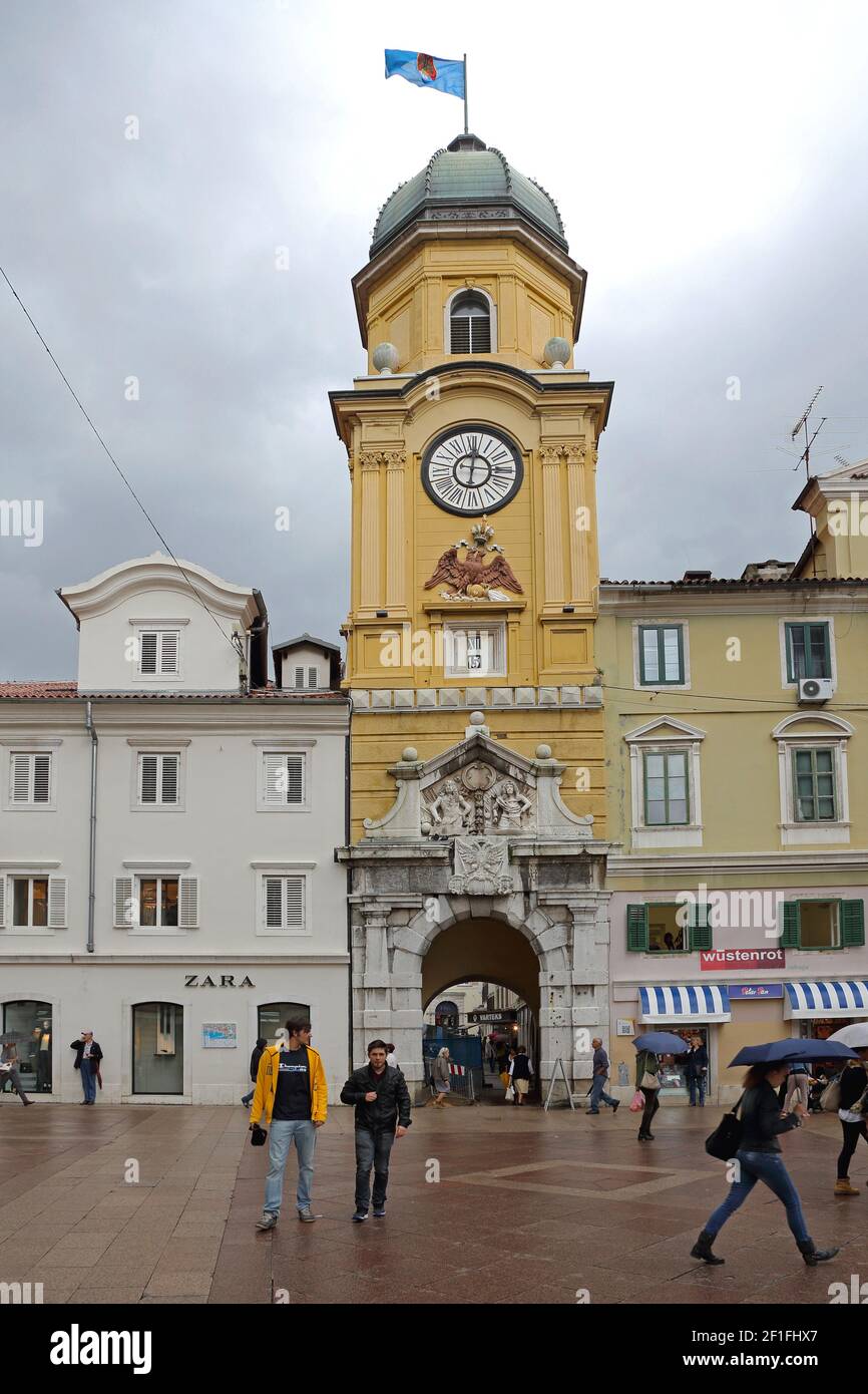 Rijeka, Croatia - October 17, 2014: Clock Tower and CIty Gate Landmark at Korzo Street in Downtown Rijeka, Croatia. Stock Photo