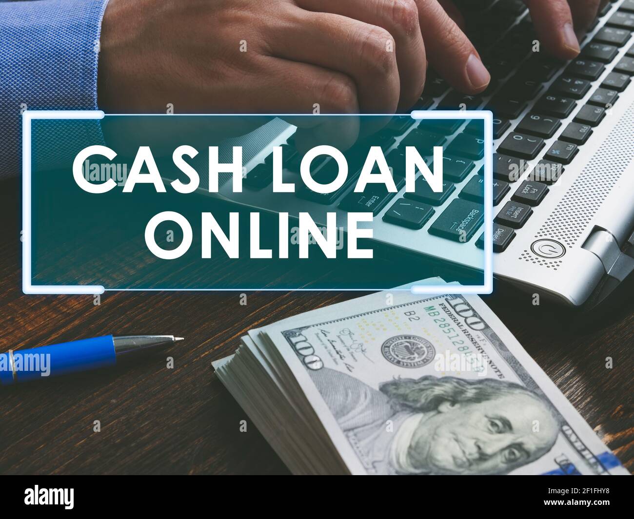 Cash loan online concept. Money and hands with keyboard Stock