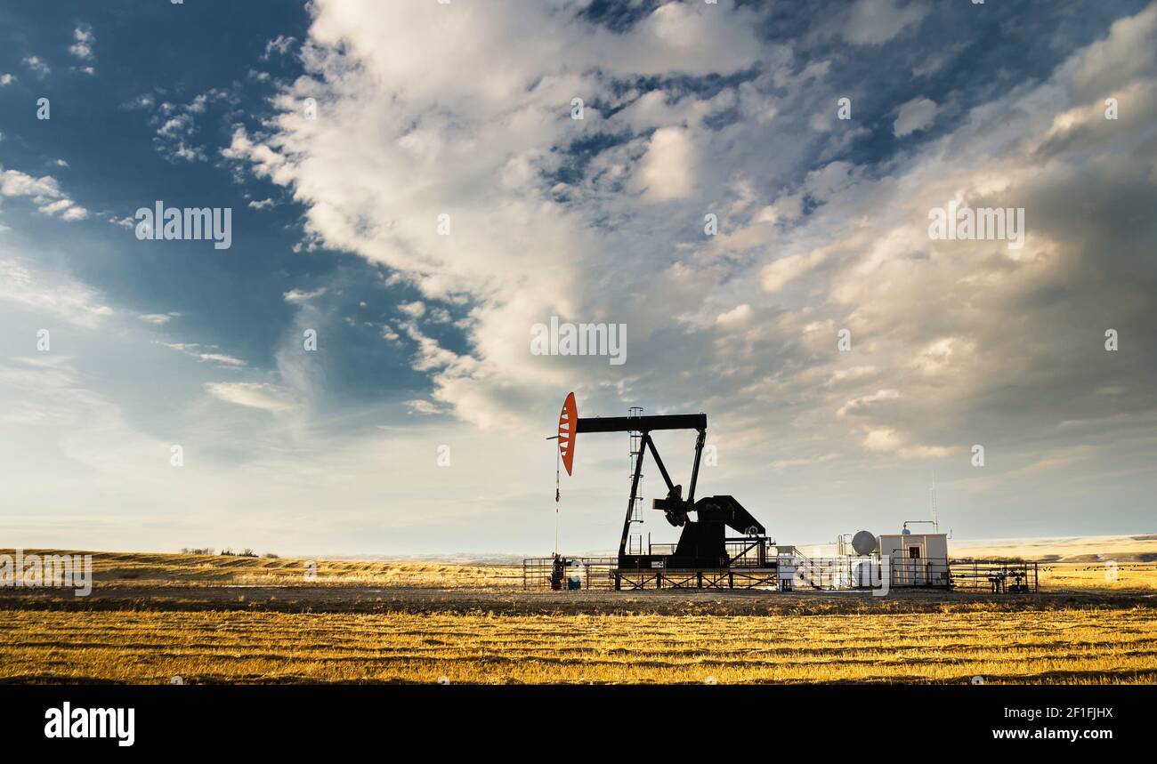 An oil and gas pump jack working on the Alberta Prairies producing