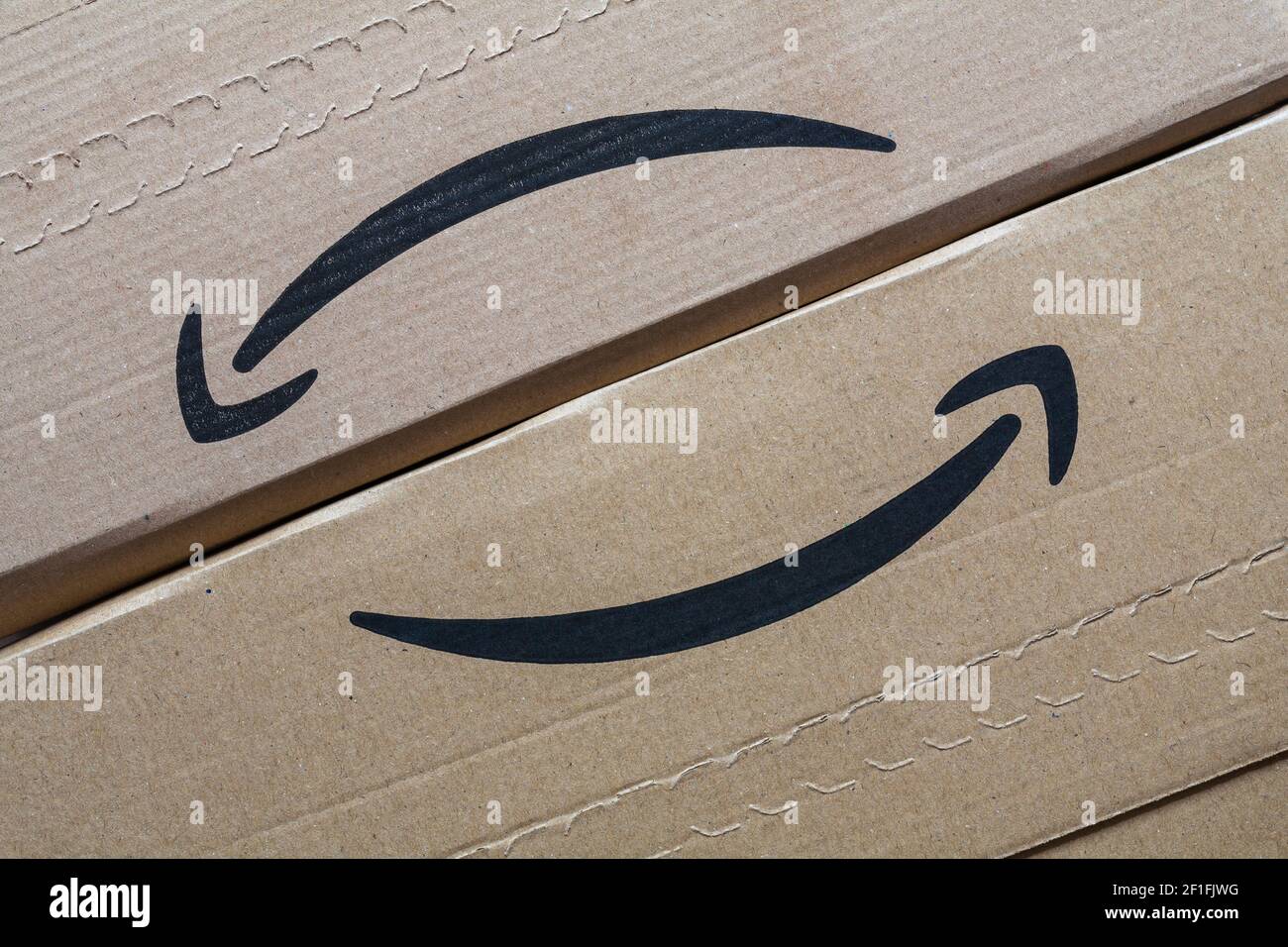 Amazon packages with logo on - Amazon company logo smile Stock Photo