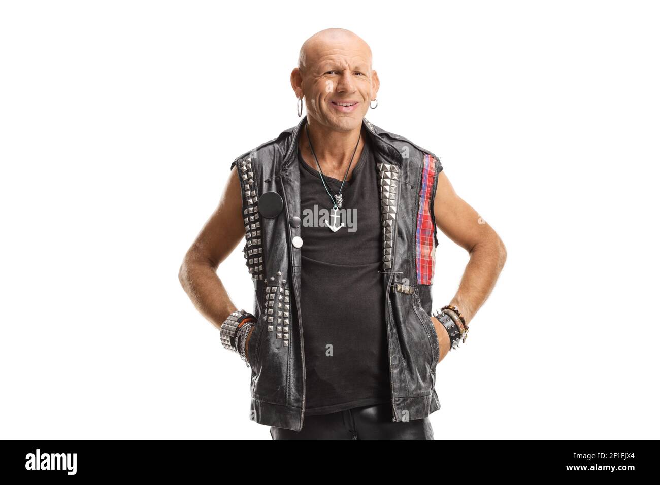 Bald punk in leather clothes standing and smiling isolated on white ...