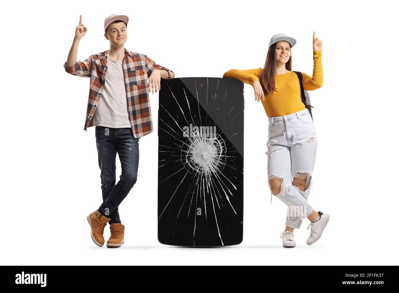 Young male and female leaning on a phone with a broken screen and pointing up isolated on white background Stock Photo