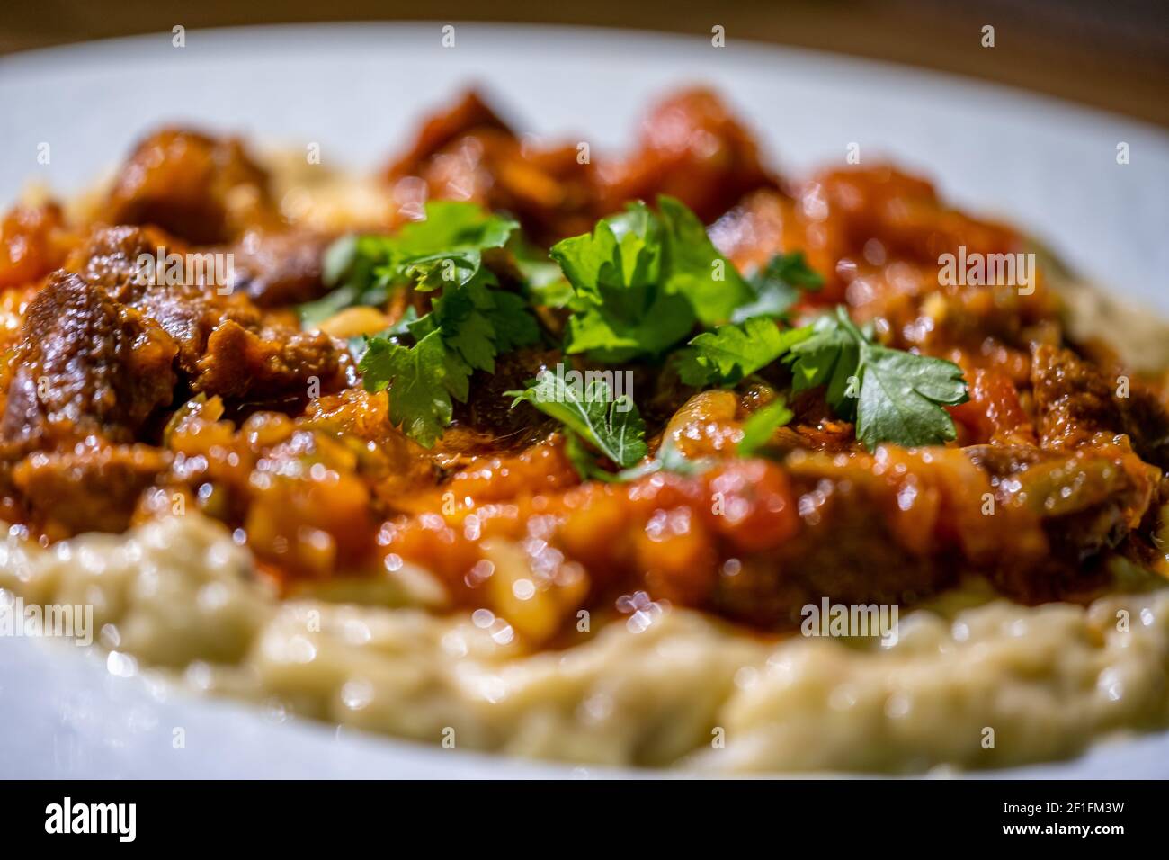 Eggplant puree with yoghurt served with seasoned ground meat Stock Photo