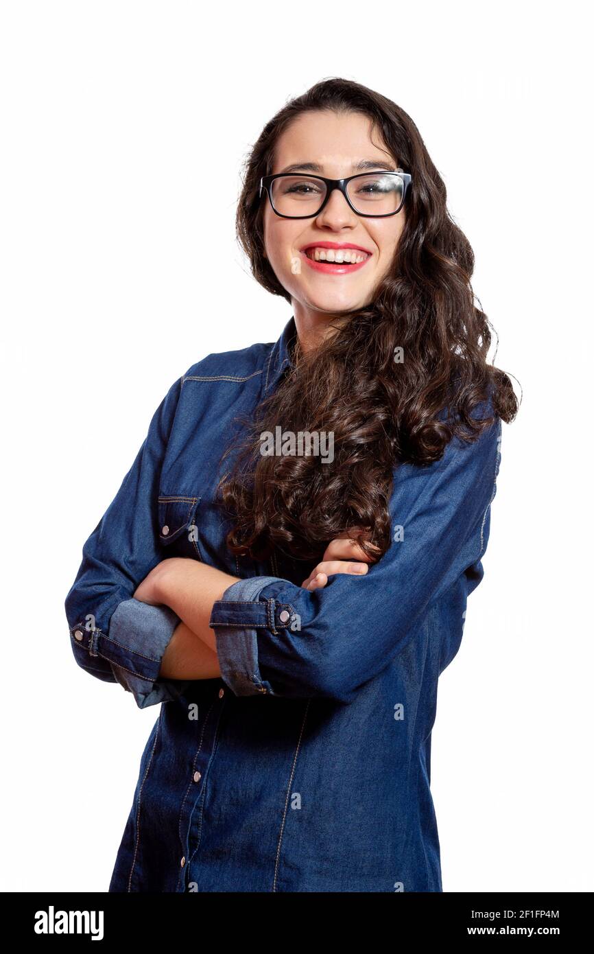 Portrait of a young confident woman with long wavy hair and glasses in ...