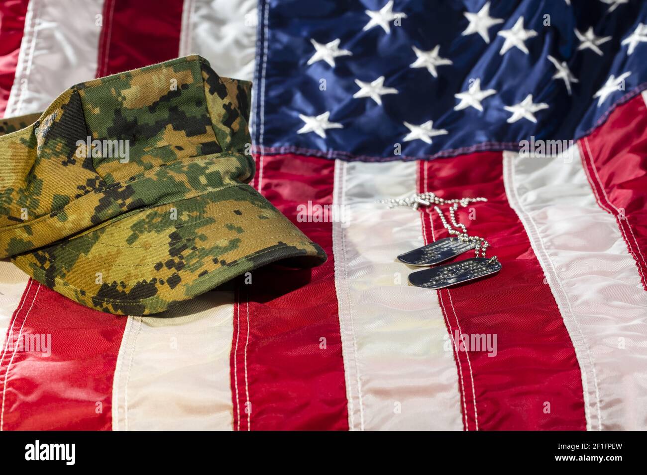 American Flag With Military Cover and Dog Tags Stock Photo - Alamy