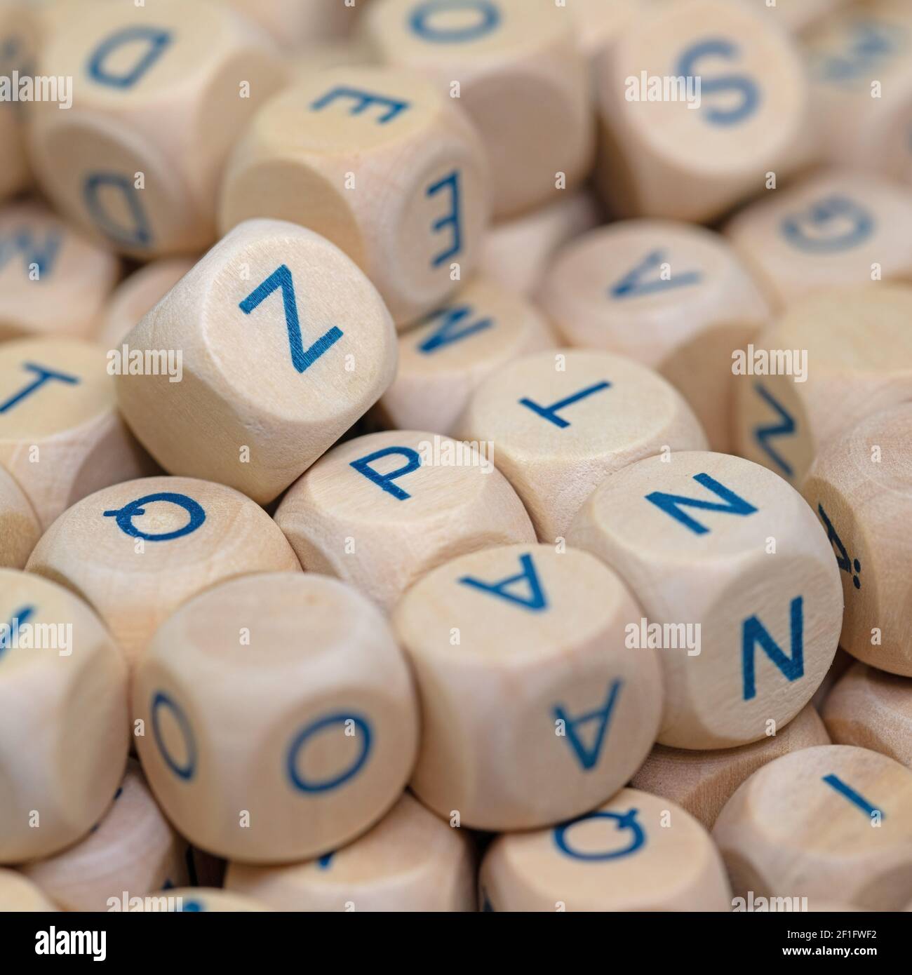 Lots of wooden cubes with letters printed on them Stock Photo