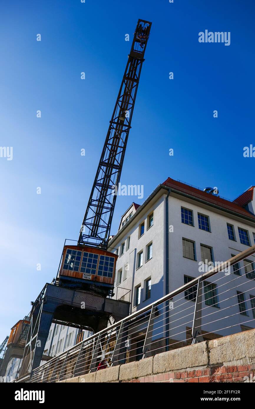 Tempelhofer harbor in Berlin, Germany, a crane on a sunny day and a blue sky Stock Photo
