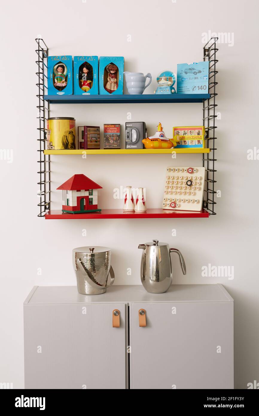 Photograph of various objects on a retro style metal shelving unit Stock Photo Alamy