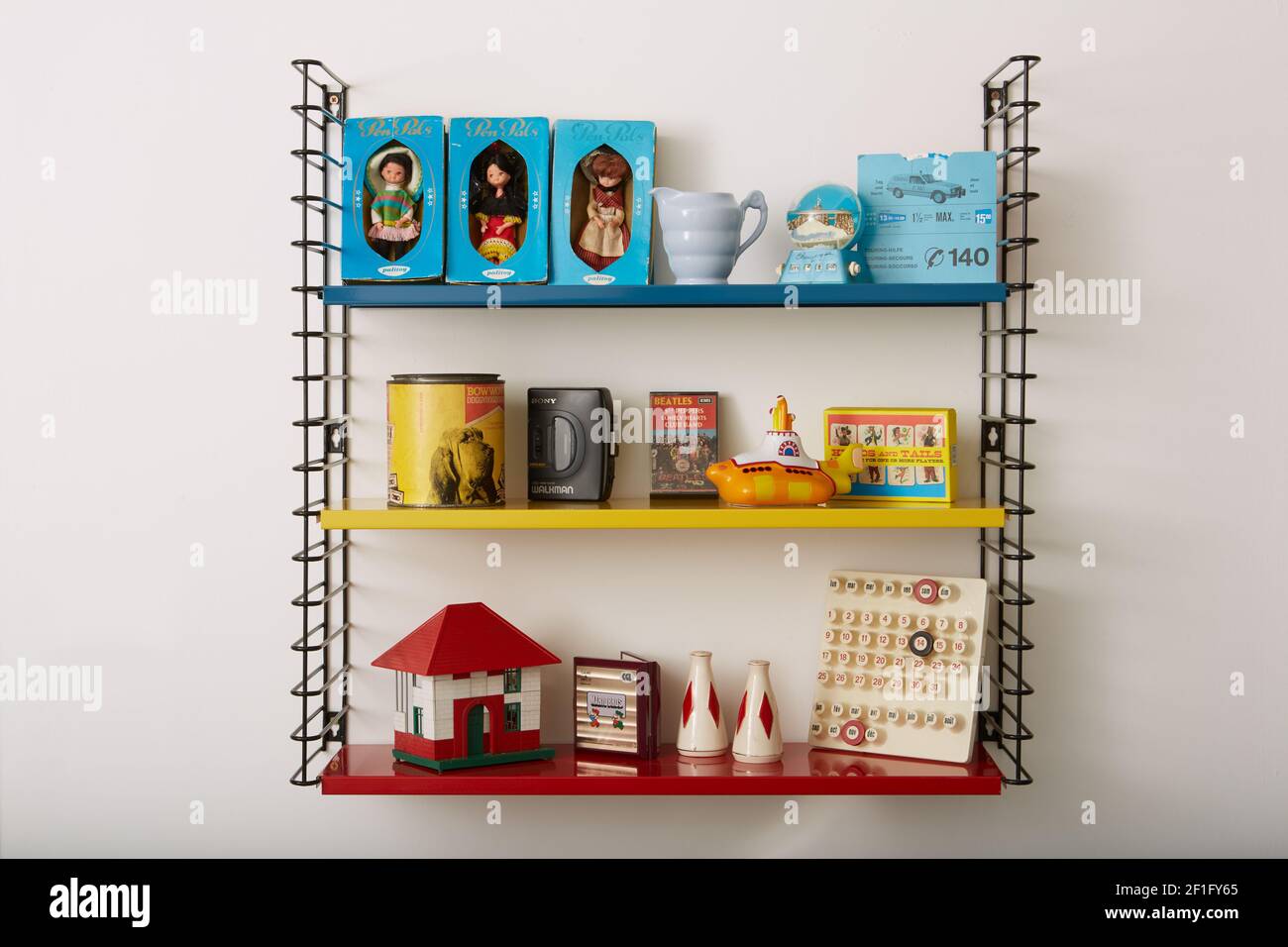 Photograph of various objects on a retro style metal shelving unit. Stock Photo