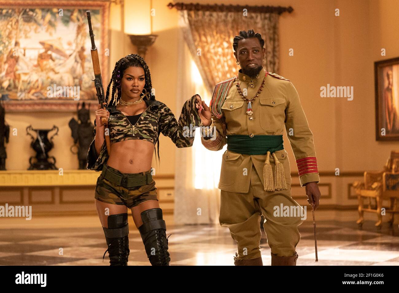 Coming 2 America (2021) directed by Craig Brewer and starring Wesley Snipes as General Izzi and Teyana Taylor as Bopoto in this sequel to the 1988 Coming to America. Stock Photo
