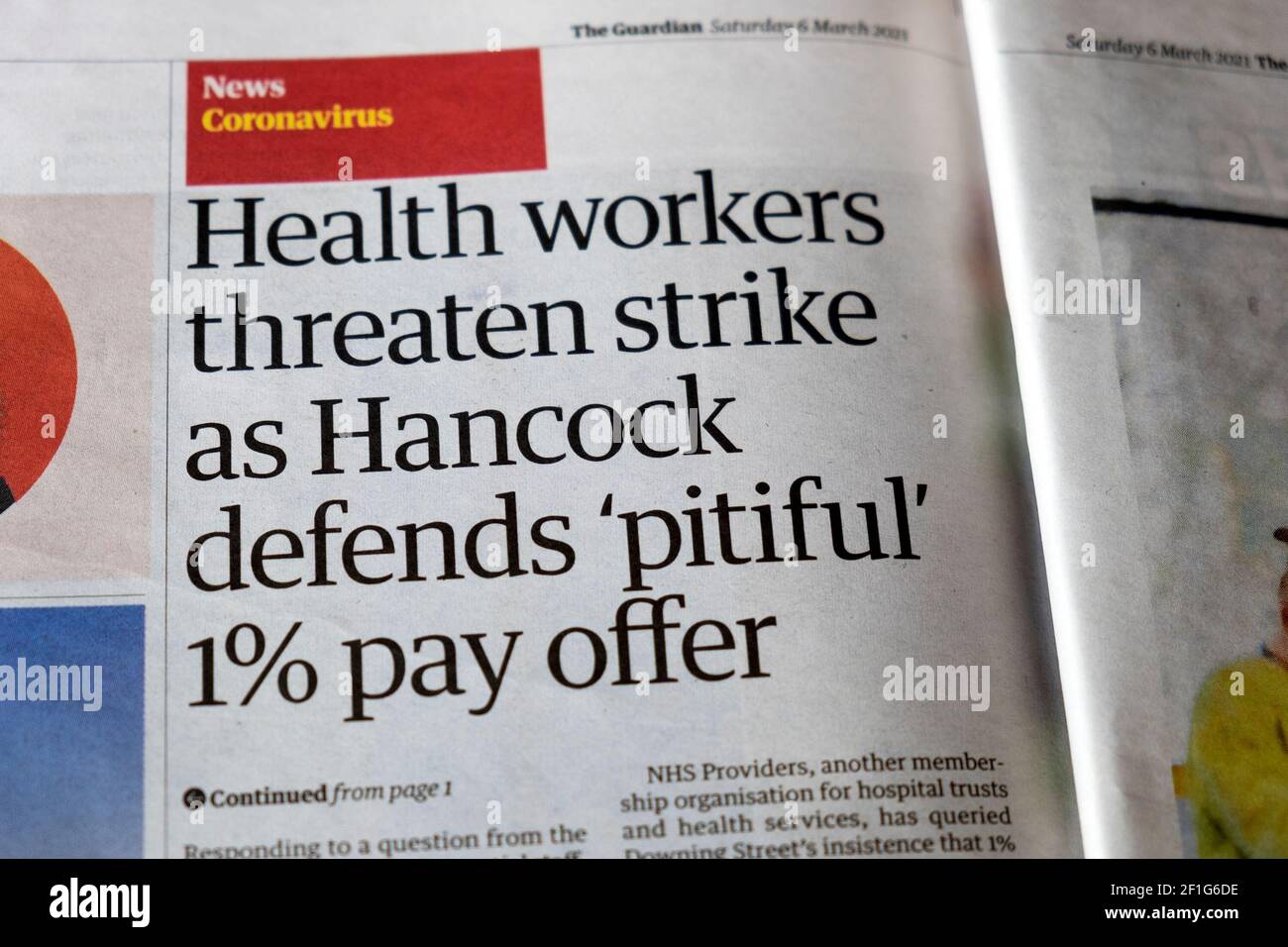 Coronavirus covid news 'Health workers threaten strike as Hancock defends 'pitiful' 1% pay offer' Guardian newspaper article 6 March 2021 London UK Stock Photo