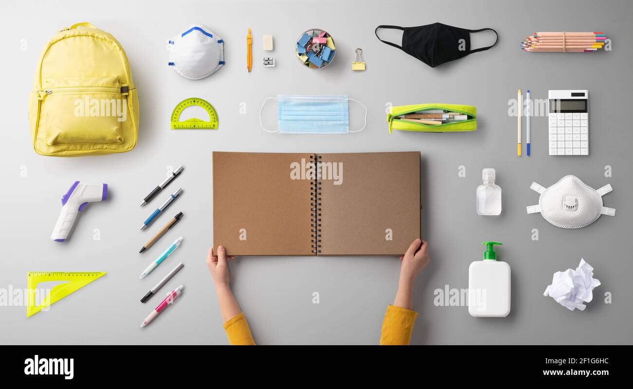 Flat lay top view of face mask and school supplies, back to school and ...