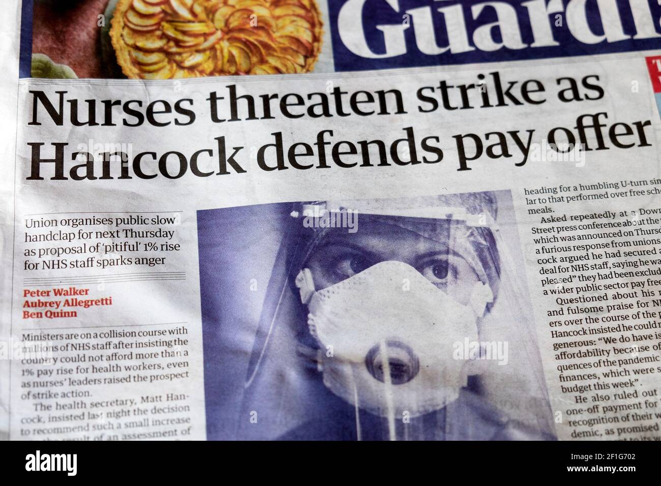 'Nurses threaten strike as Hancock defends pay offer' during covid 19 coronavirus pandemic in Guardian newspaper headline on 6 March 2021 London UK Stock Photo