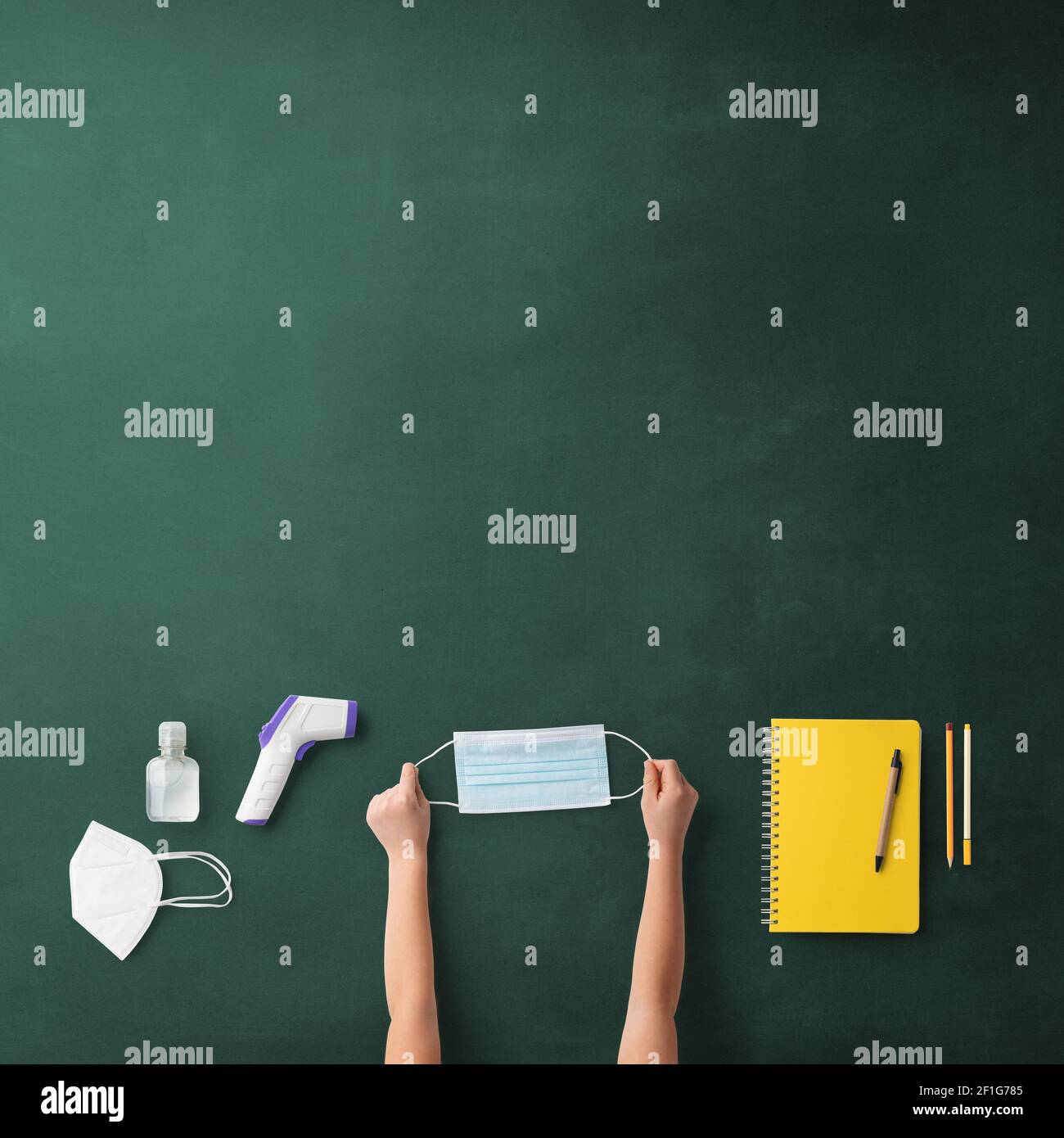 Flat lay top view of face mask and school supplies, back to school and ...