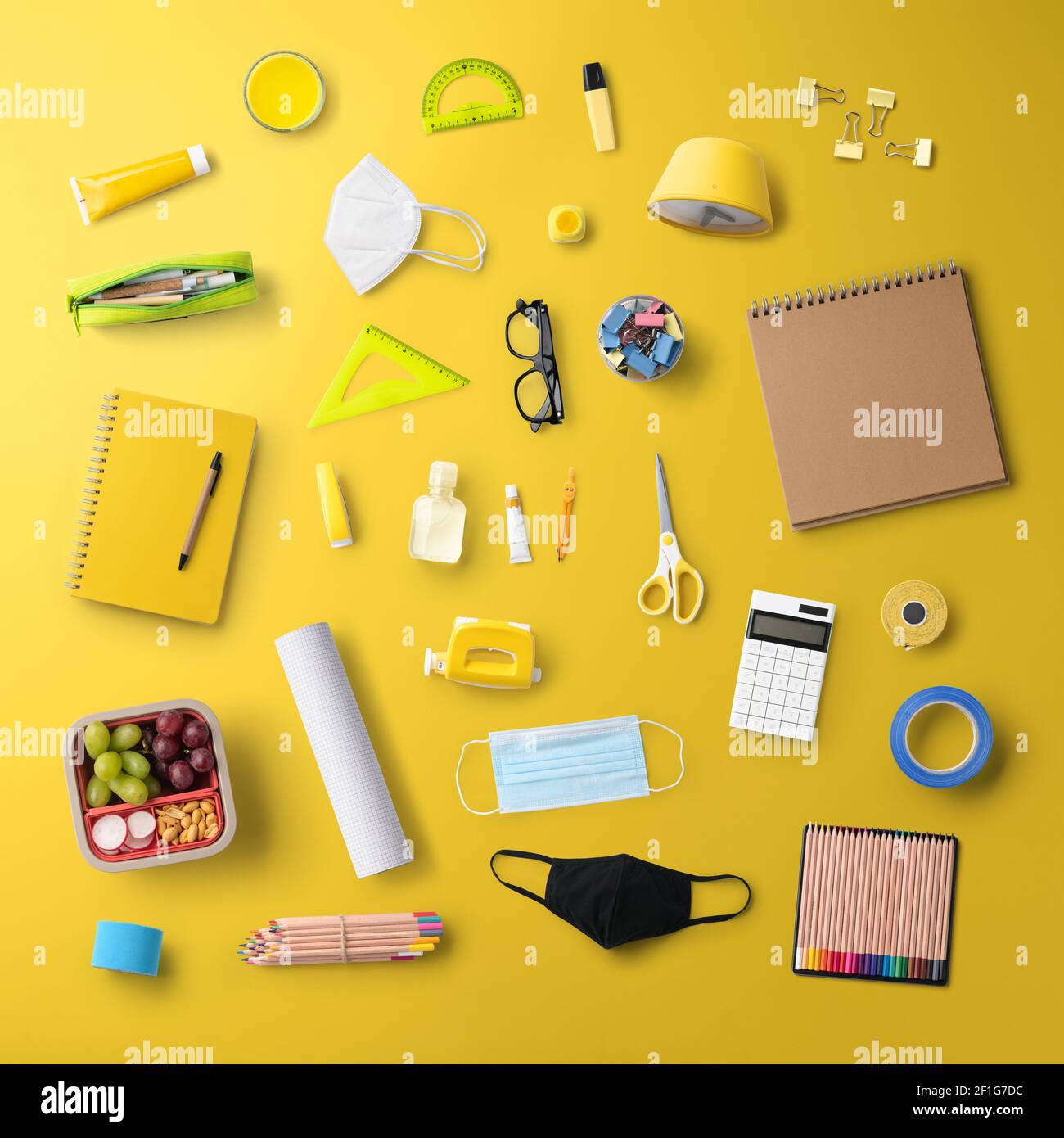 Flat lay top view of face mask and school supplies, back to school and ...