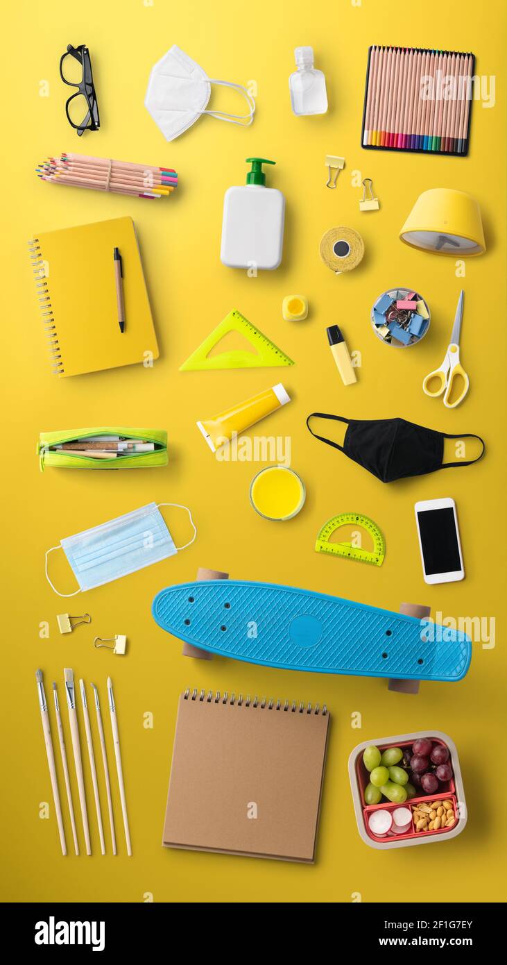 Flat lay top view of face mask and school supplies, back to school and ...