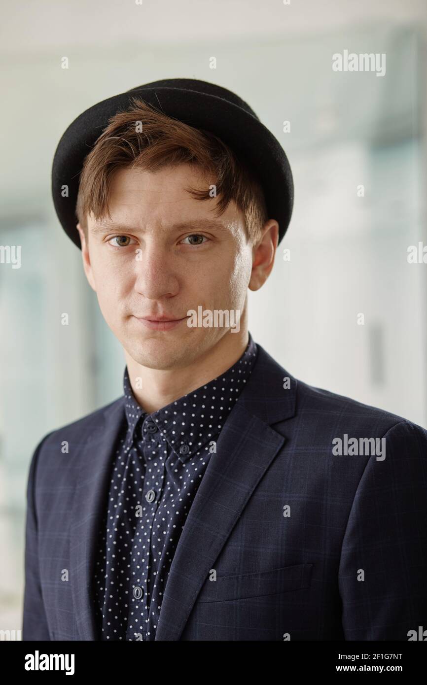 Confident handsome business man in suit and hat Stock Photo