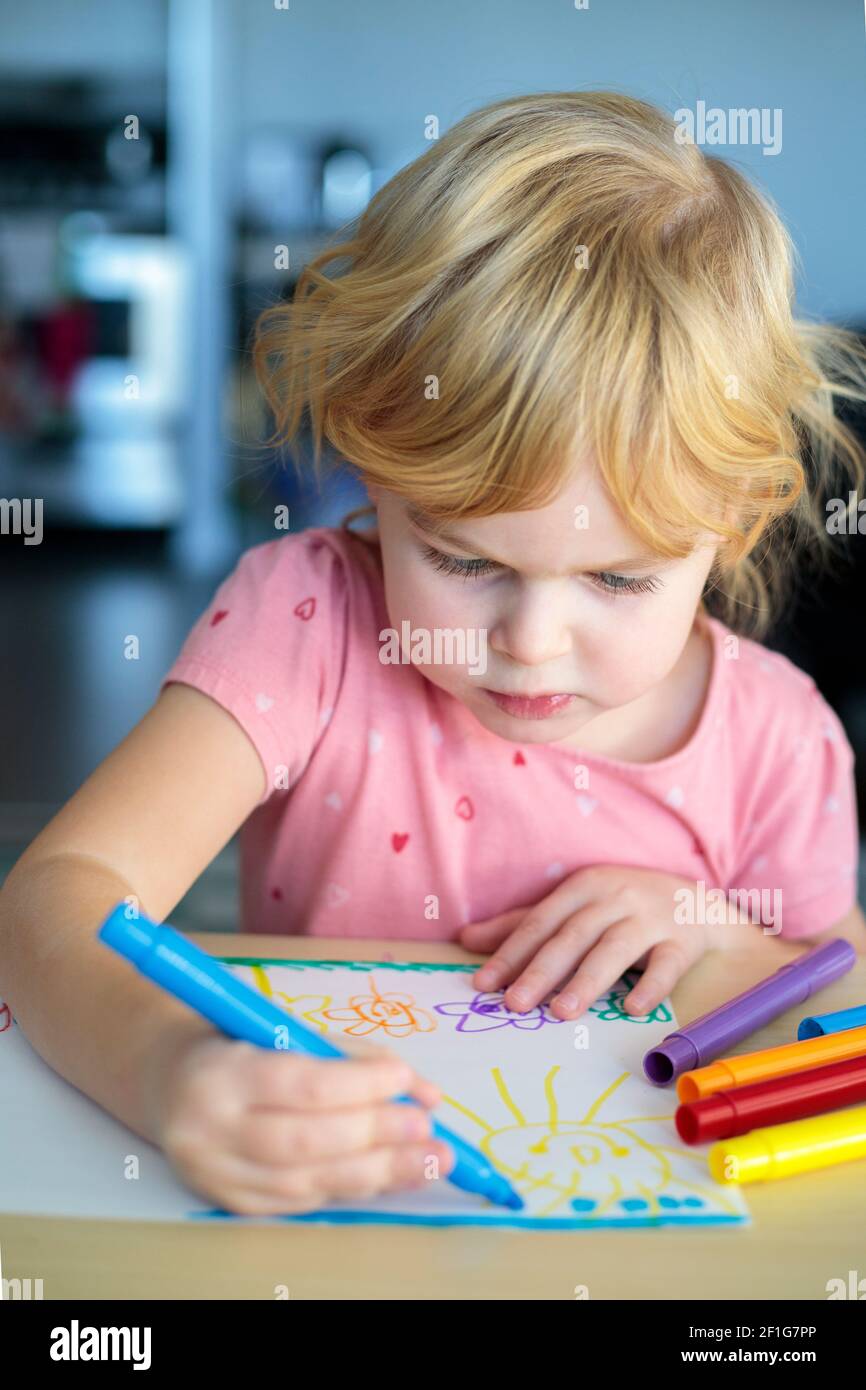 Little girl drawing with colored markers Stock Photo Alamy