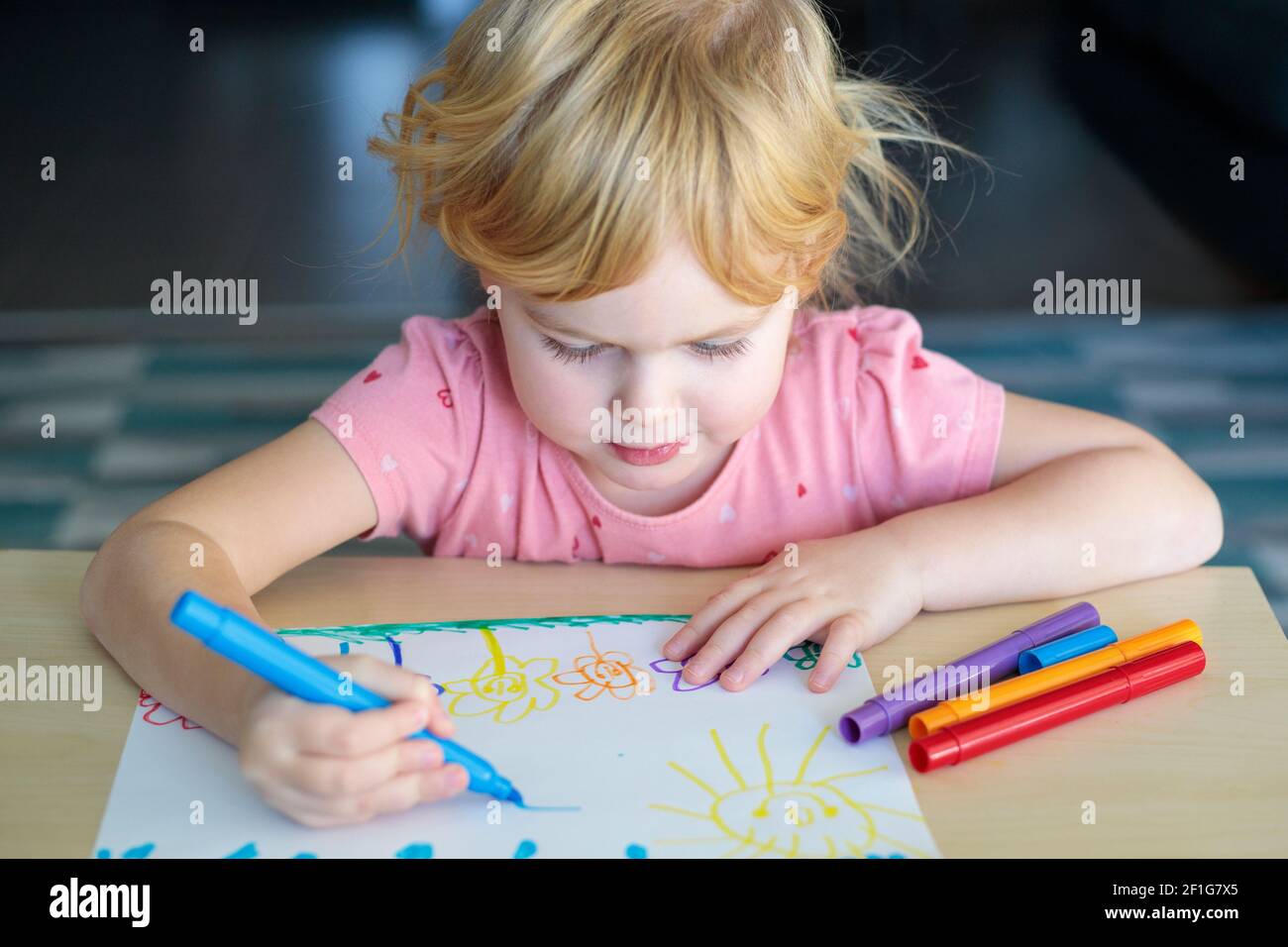 Little girl drawing with colored markers Stock Photo Alamy
