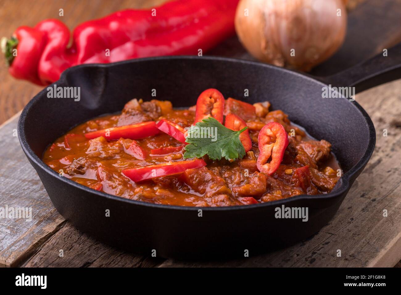 hungarian goulash in an iron pan Stock Photo - Alamy