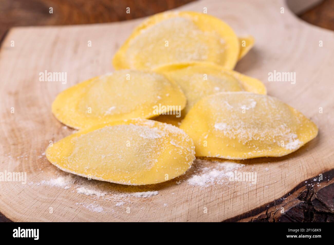 raw italian tortelli pasta with flour Stock Photo