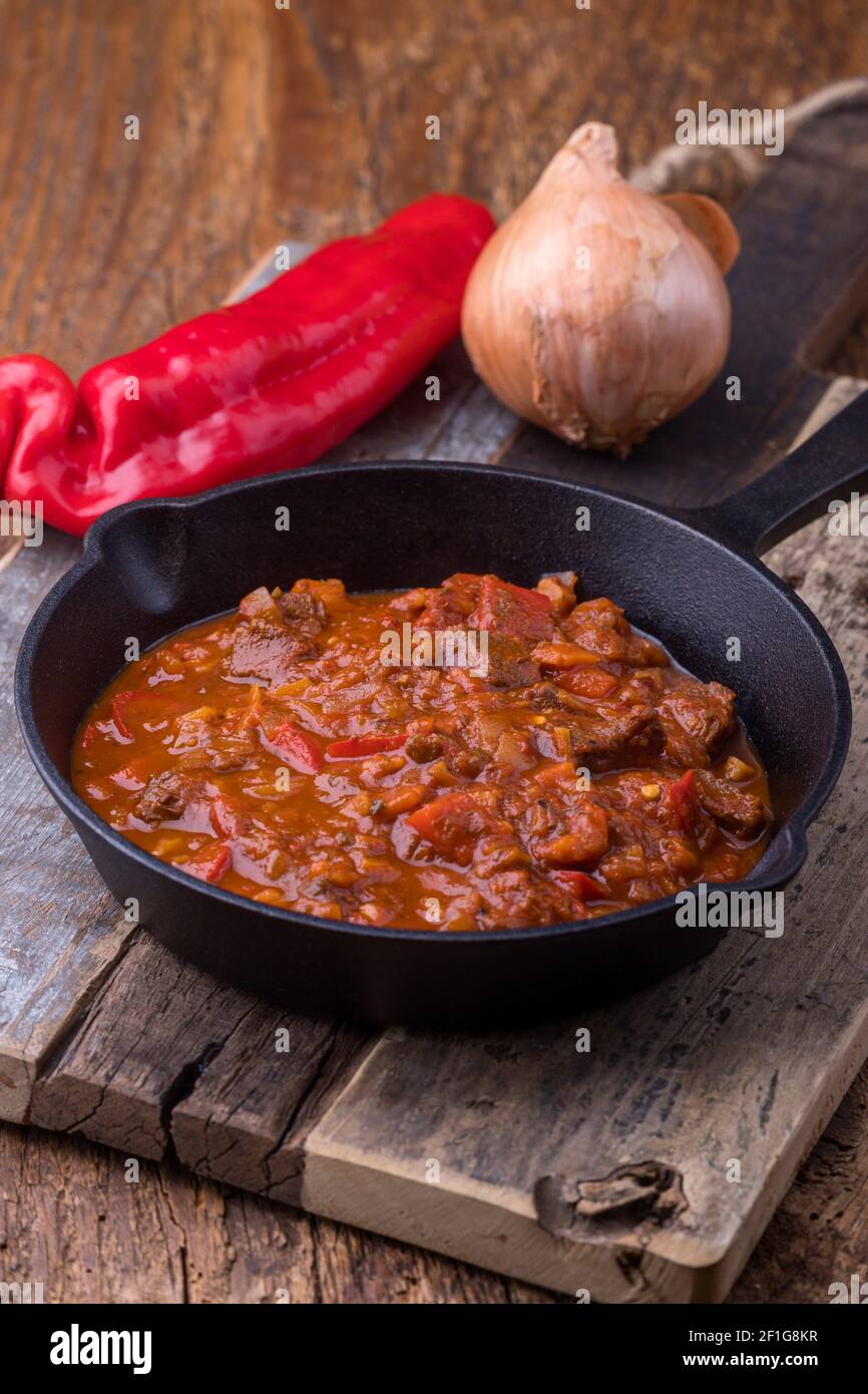 hungarian goulash in an iron pan Stock Photo - Alamy