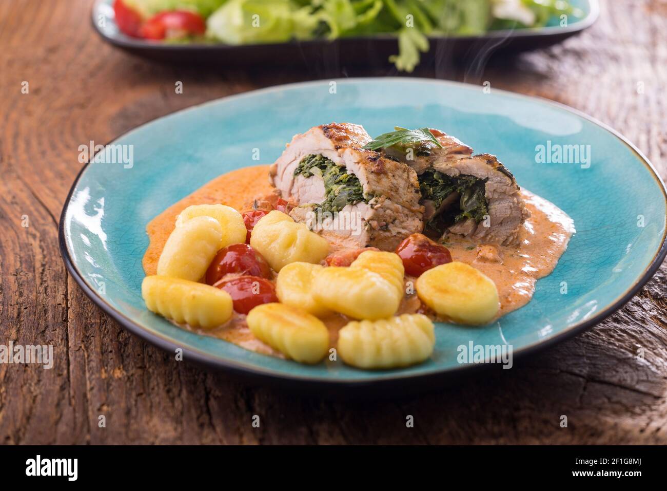 pork fillet with gnocchi and cream sauce Stock Photo Alamy