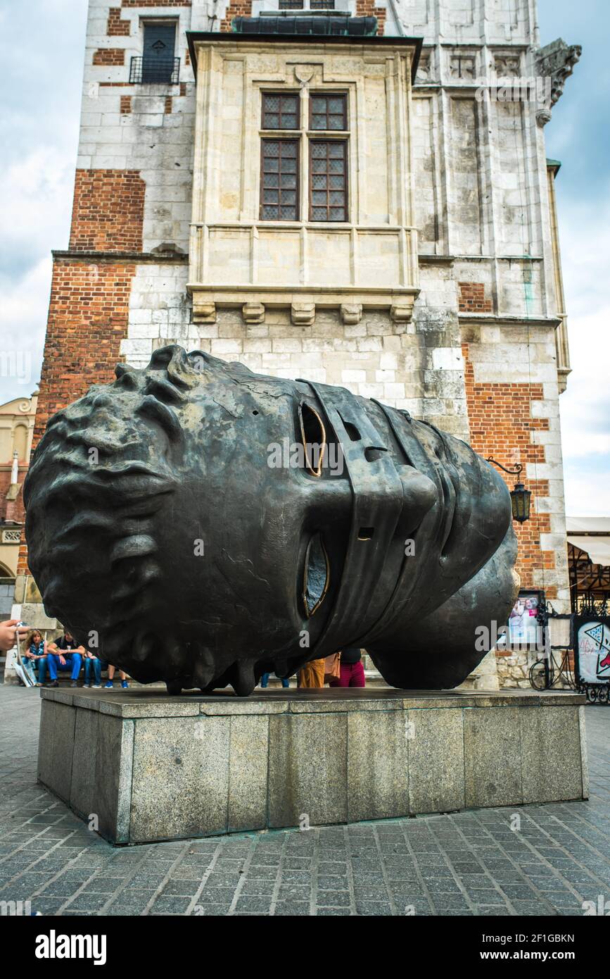 Bronze monument sculpture head in the market square of Krakow Stock