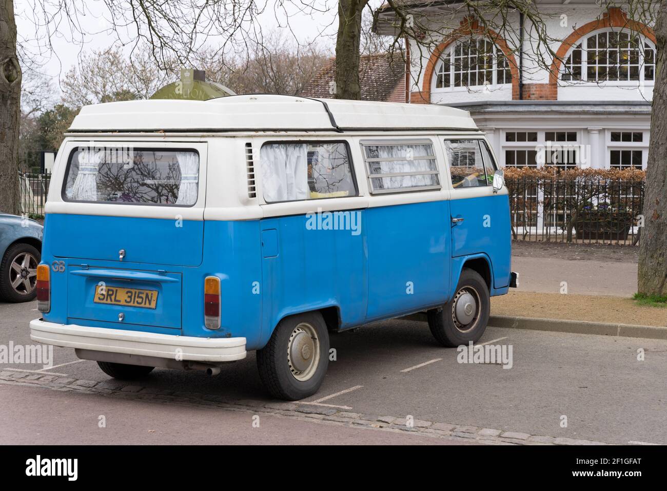 VOLKSWAGEN MOTOR CARAVAN in blue and white parked  in London greenwich park Stock Photo