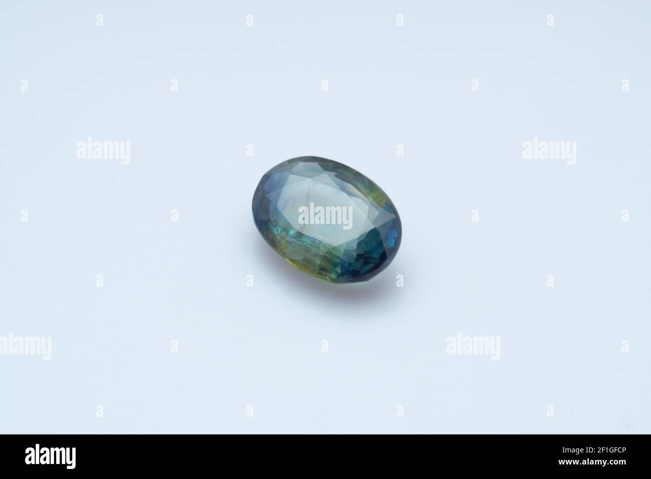 Natural stone sapphire on a white background Stock Photo - Alamy