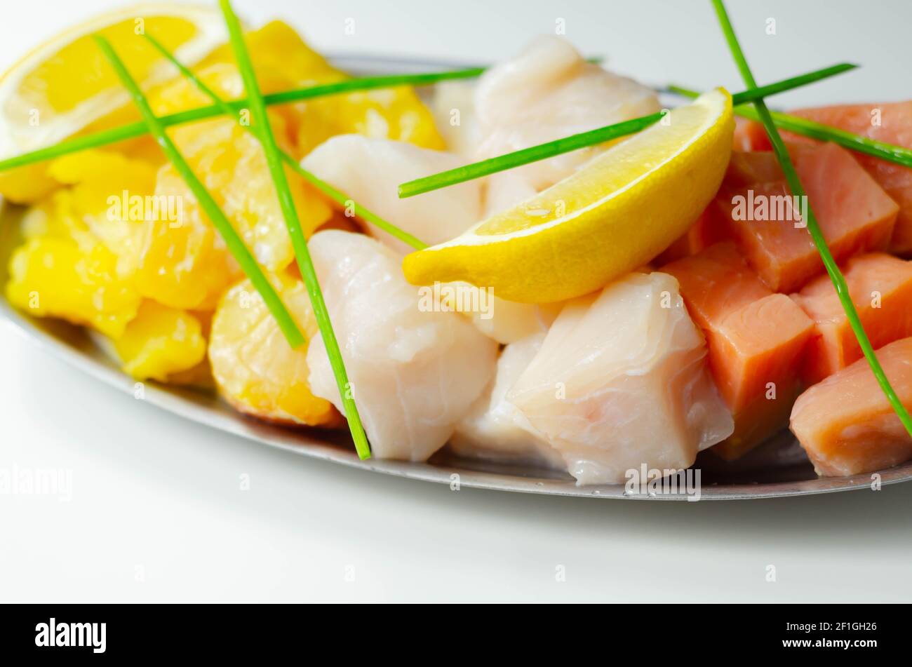 Fish pie mix, defrosted, skinless and boneless cod, dyed smoked haddock