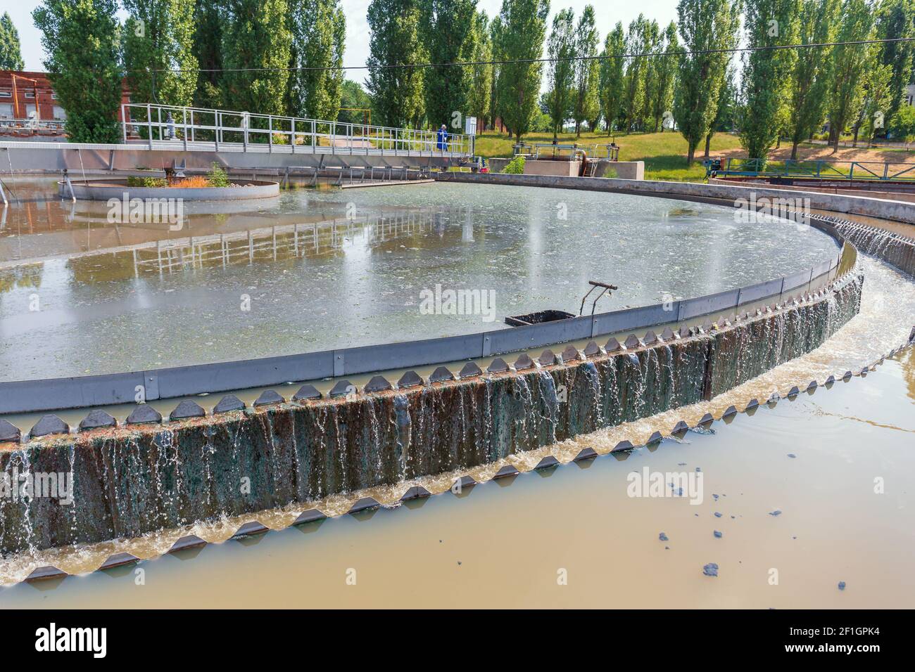 Modern wastewater treatment plant. Round tanks for sedimentation of dirty water. Stock Photo