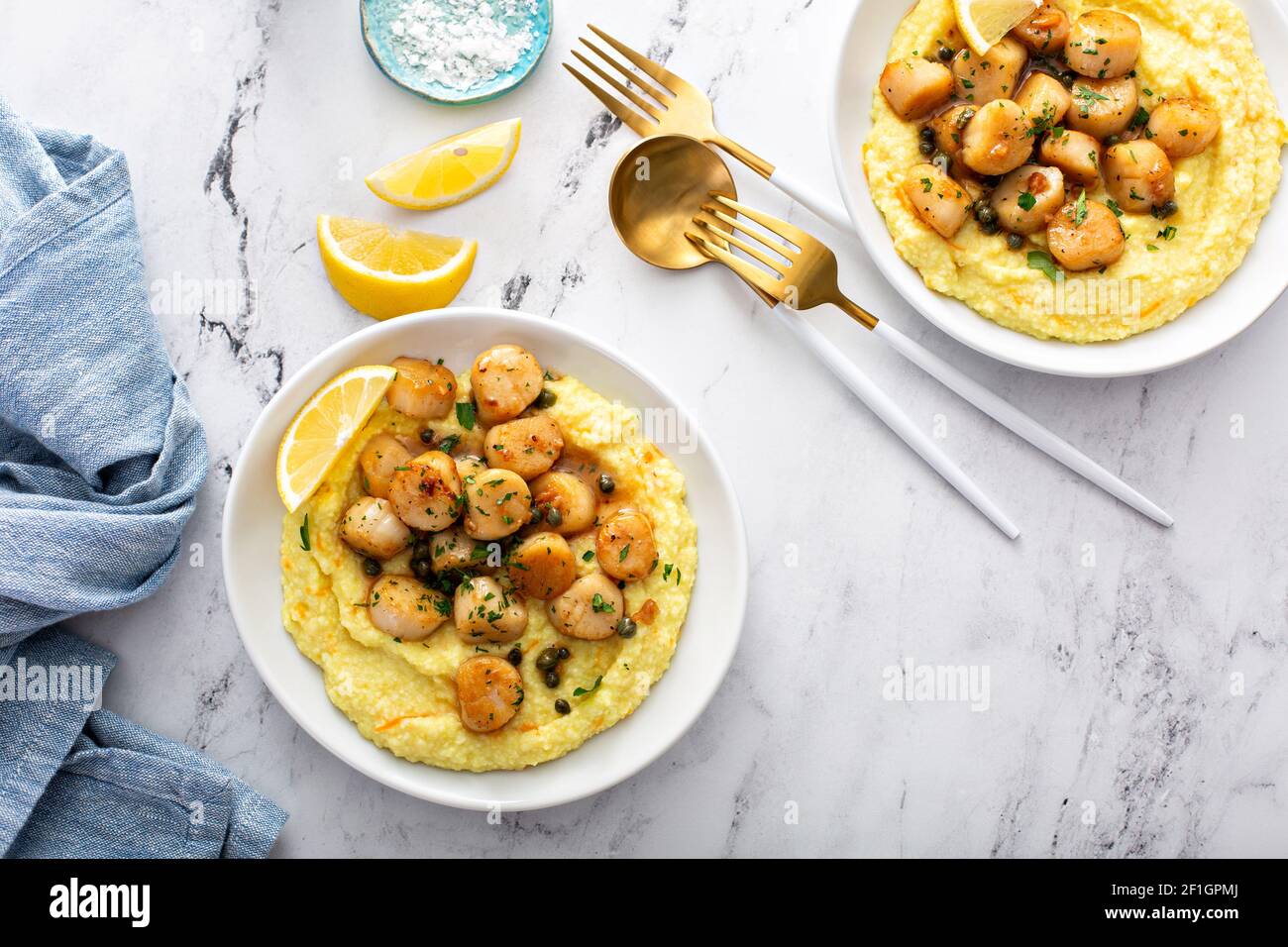Seared scallops with grits Stock Photo Alamy
