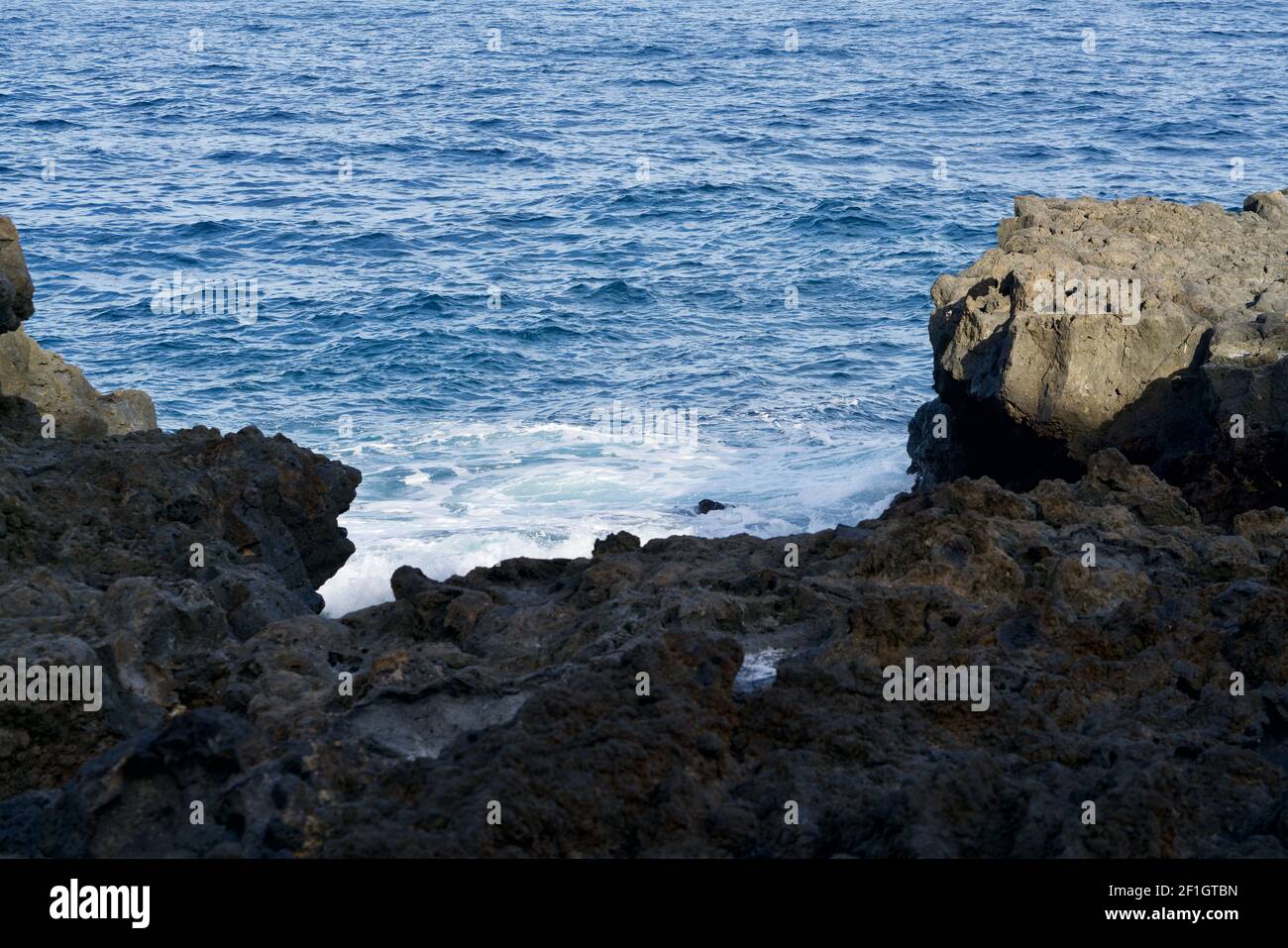 Ocean spray at a raw cliff Stock Photo