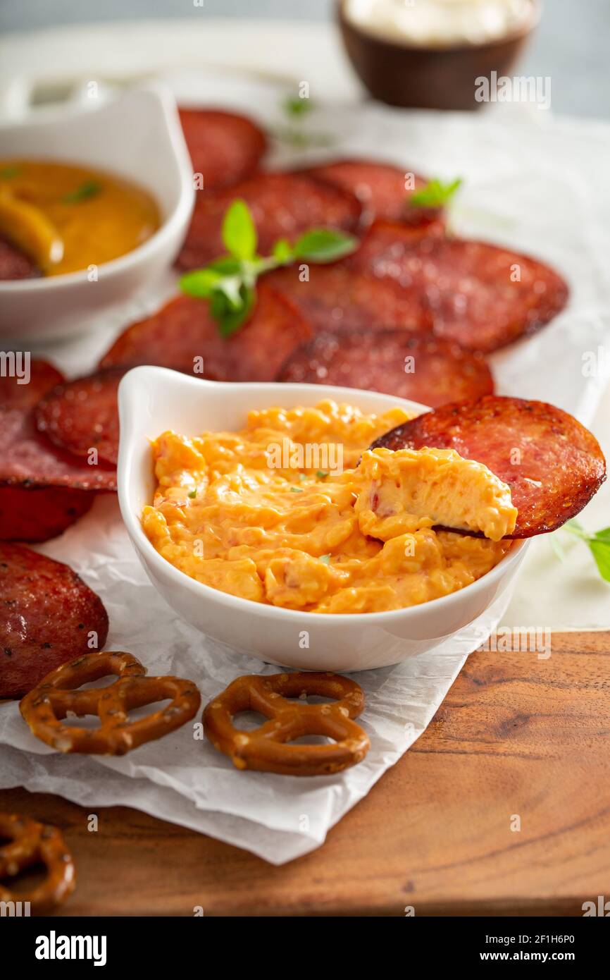 Salami chips baked in the oven with cheese sauces Stock Photo Alamy