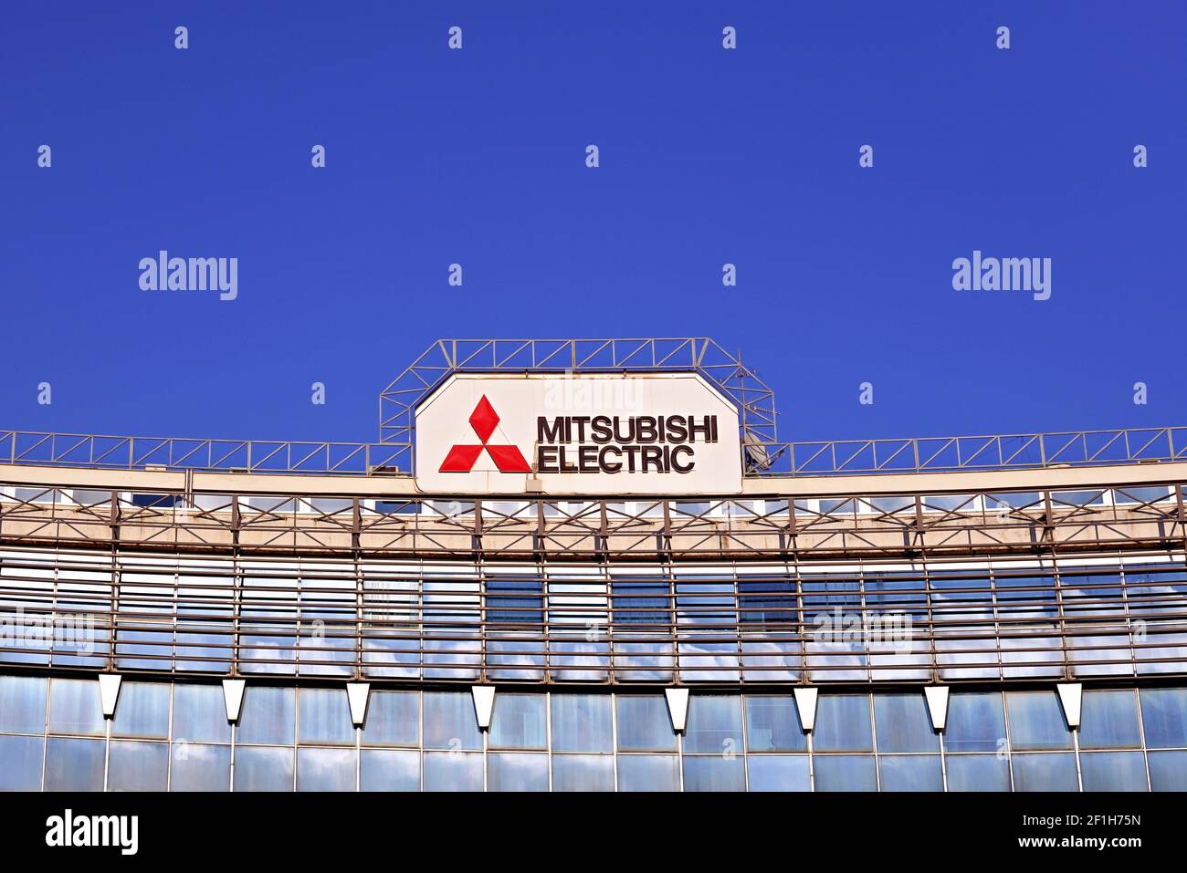 Mitsubishi Electric logo sign on the roof of a building. Rome, Italy, Europe, EU Stock Photo