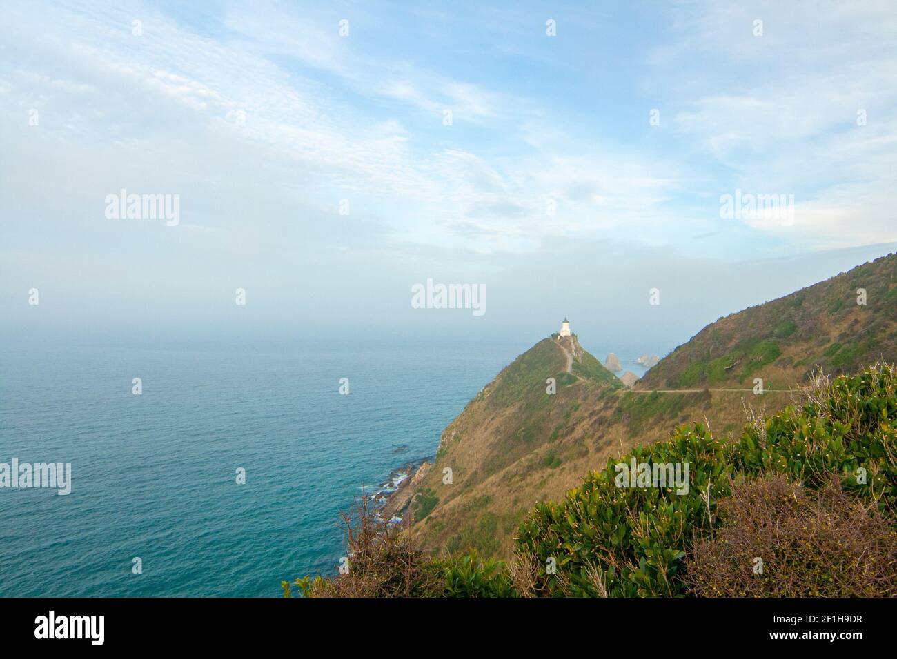 Pacific Ocean coast of Nugget Point Lighthouse New Zealand landscape, the Catlins coast Stock Photo