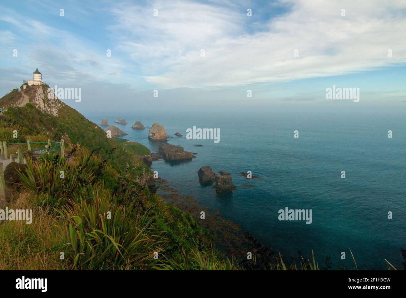 Iconic landforms and rocky islets of Nugget Point Lighthouse New Zealand, the Catlins coast Stock Photo