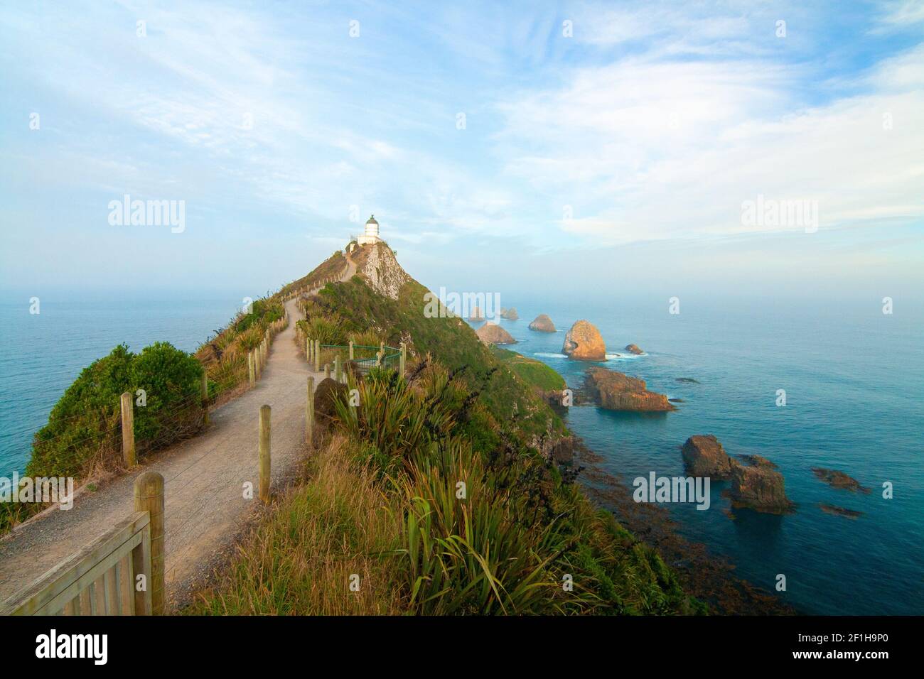 Nugget Point lighthouse and famous rocky islets (The Nuggets) South Island of New Zealand Stock Photo