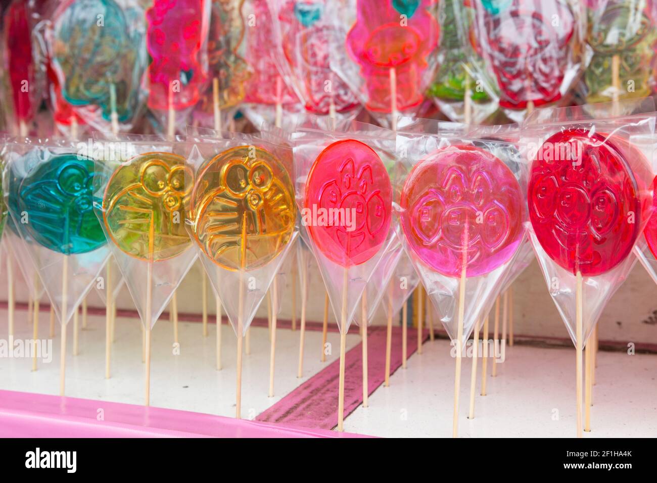 Stall selling lollipops, and candy at Sensoji Temple during
