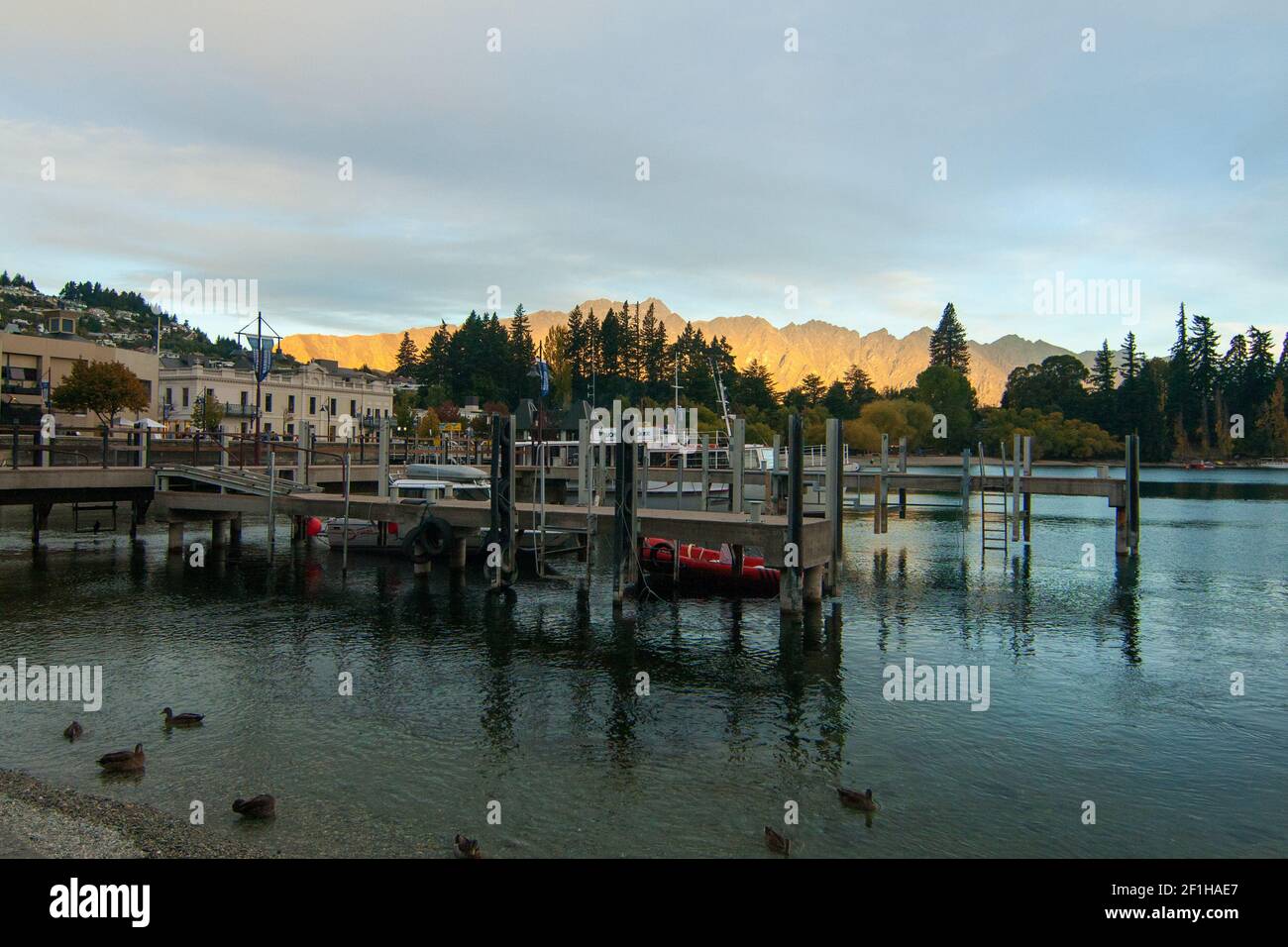 Queenstown Harbour View Walk, South Island New Zealand, The Remarkables at sunset Stock Photo