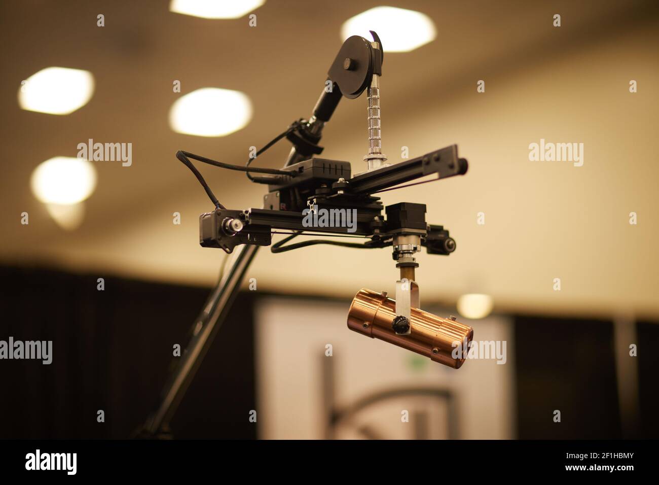 Copper microphone on remote positioning device overhead orchestral stand Musical Instrument Convention Stock Photo