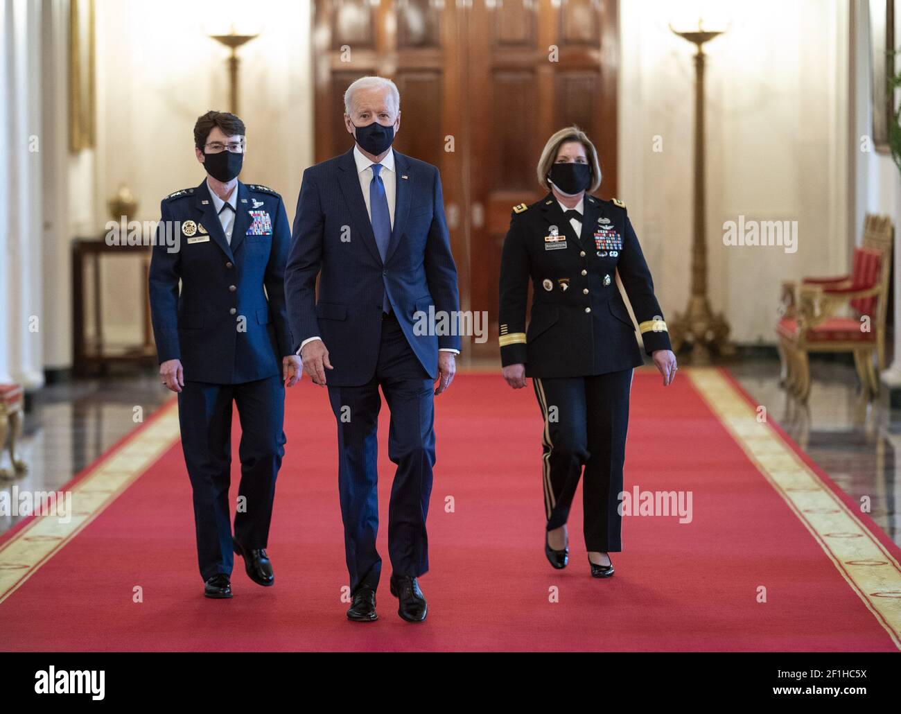 Washington, United States. 08th Mar, 2021. President Joe Biden walks with his Combatant Commander nominees, Air Force Gen. Jacqueline Van Ovost (L) and Army Lt. Gen. Laura Richardson as they arrives for their nomination announcement in the East Room at the White House in Washington, DC on Monday, March 8, 2021. Ovost, has been nominated to lead the Transportation Command and Richardson, has been nominated to lead military activities in Latin America at Southern Command. Photo by Kevin Dietsch/UPI Credit: UPI/Alamy Live News Stock Photo