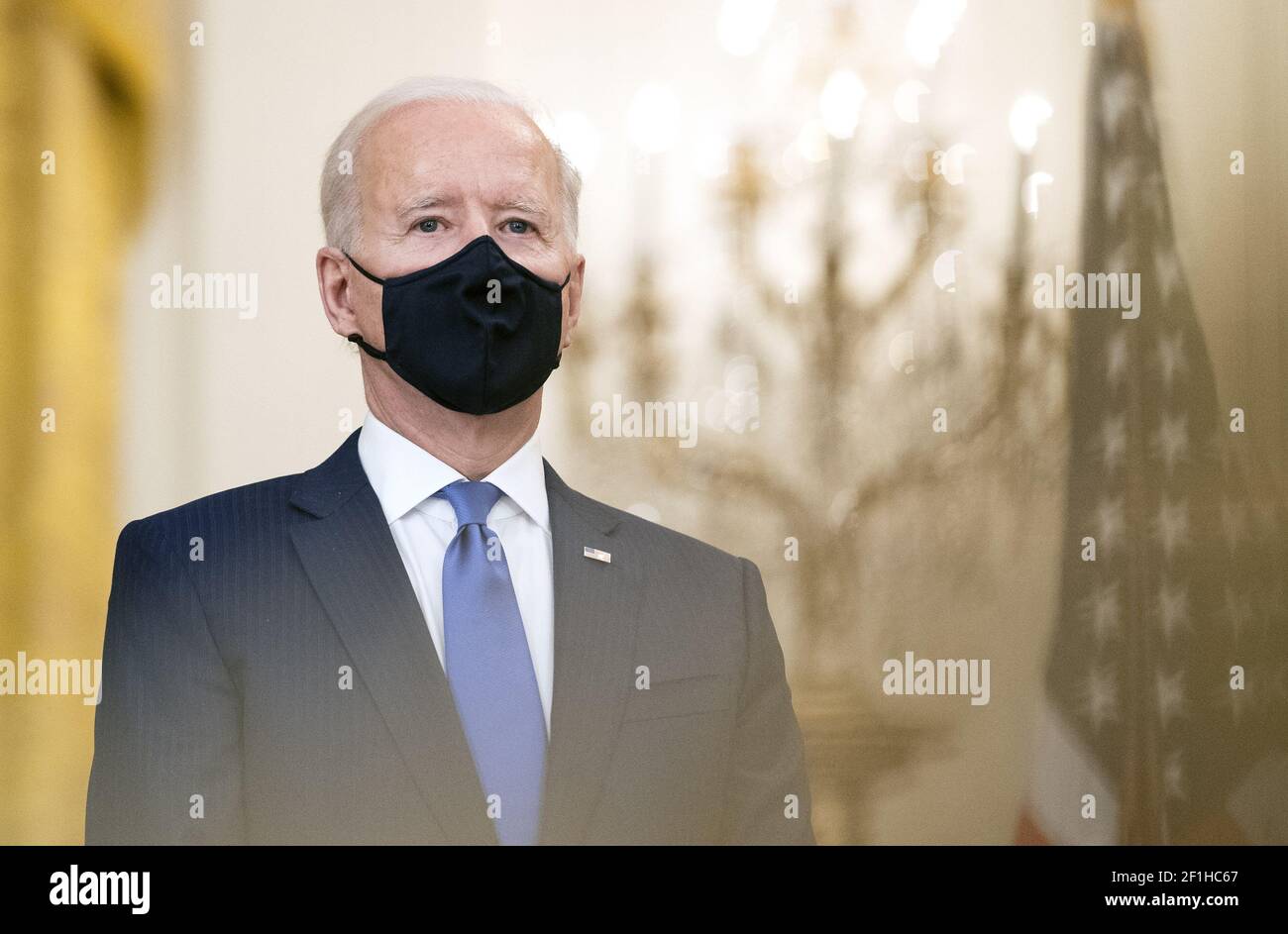 Washington, United States. 08th Mar, 2021. President Joe Biden listens as Vice President Kamala Harris delivers remarks at a Combatant Commander nomination event for, Air Force Gen. Jacqueline Van Ovost and Army Lt. Gen. Laura Richardson in the East Room at the White House in Washington, DC on Monday, March 8, 2021. Ovost, has been nominated to lead the Transportation Command and Richardson, has been nominated to lead military activities in Latin America at Southern Command. Photo by Kevin Dietsch/UPI Credit: UPI/Alamy Live News Stock Photo