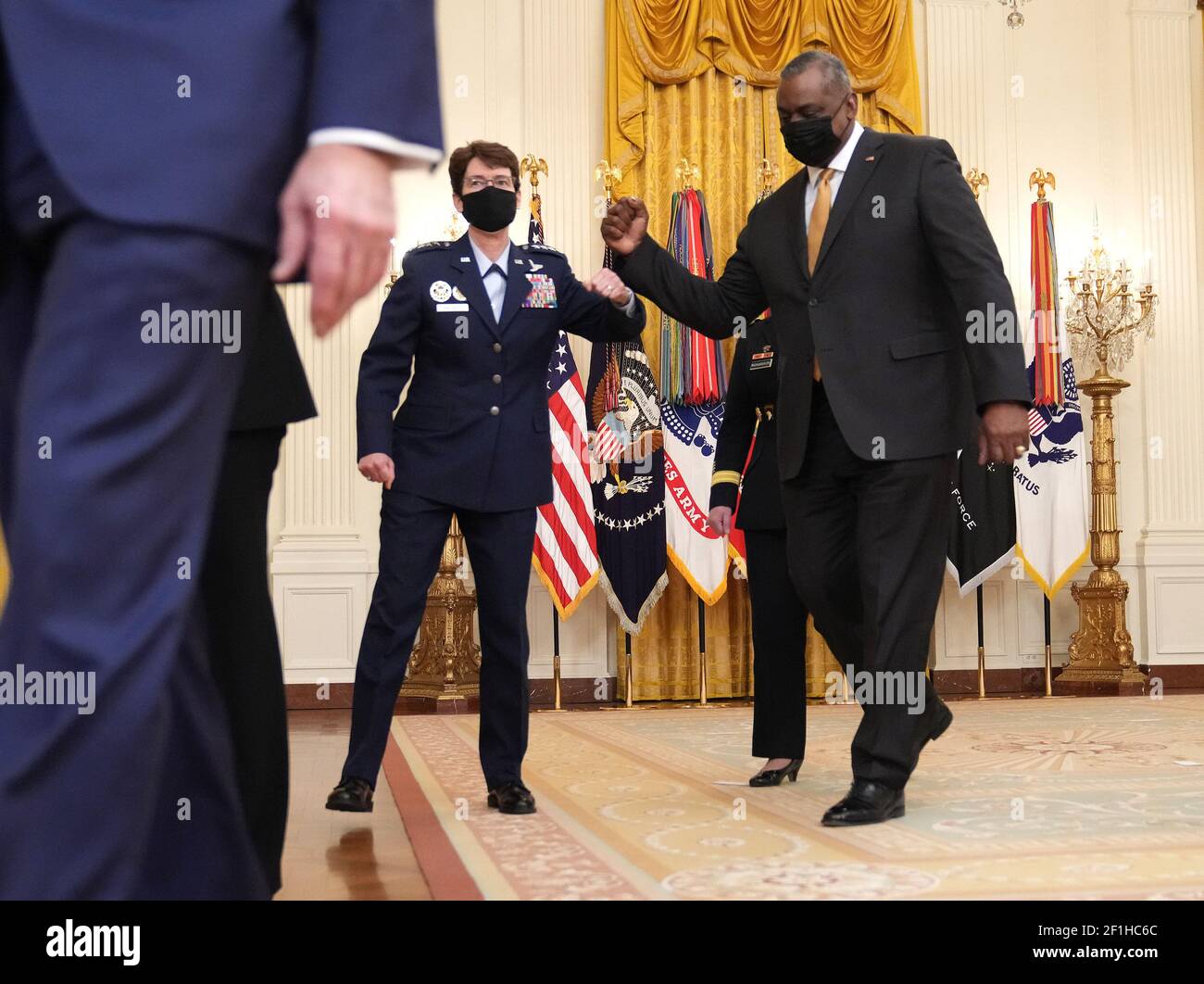 Washington, United States. 08th Mar, 2021. President Joe Biden's Combatant Commander nominee Air Force Gen. Jacqueline Van Ovost fist bumps Defense Secretary Lloyd Austin after Biden introduced her and Army Lt. Gen. Laura Richardson as his nominees, in the East Room at the White House in Washington, DC on Monday, March 8, 2021. Ovost has been nominated to lead the Transportation Command and Richardson, has been nominated to lead military activities in Latin America at Southern Command. Photo by Kevin Dietsch/UPI Credit: UPI/Alamy Live News Stock Photo