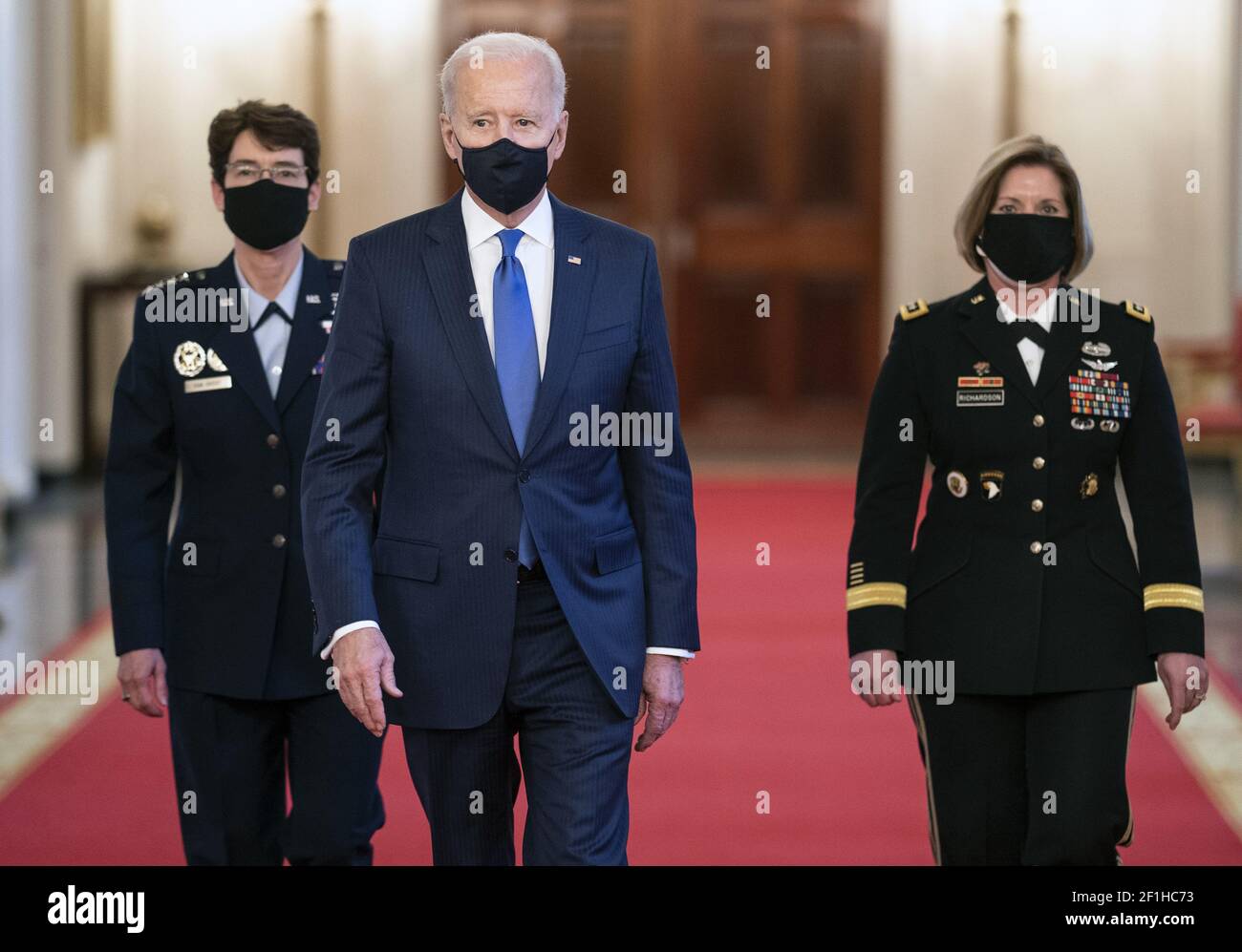 Washington, United States. 08th Mar, 2021. President Joe Biden walks with his Combatant Commander nominees, Air Force Gen. Jacqueline Van Ovost (L) and Army Lt. Gen. Laura Richardson as they arrives for their nomination announcement in the East Room at the White House in Washington, DC on Monday, March 8, 2021. Ovost, has been nominated to lead the Transportation Command and Richardson, has been nominated to lead military activities in Latin America at Southern Command. Photo by Kevin Dietsch/UPI Credit: UPI/Alamy Live News Stock Photo