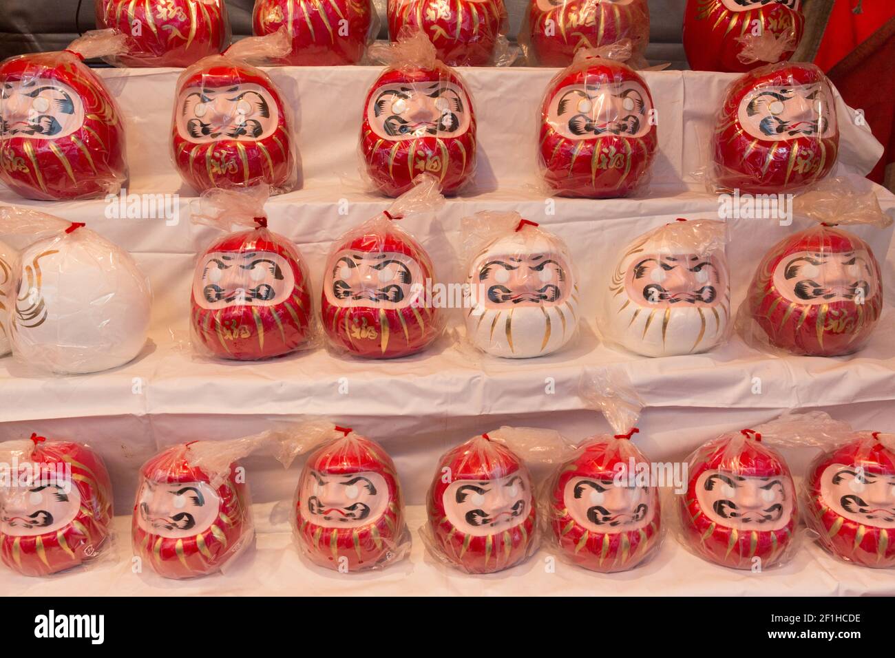 Daruma Dolls for sale at a vending stall, in Tokyo Stock Photo