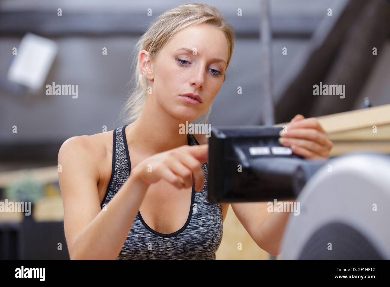 Woman practicing rowing exercise hi-res stock photography and images ...