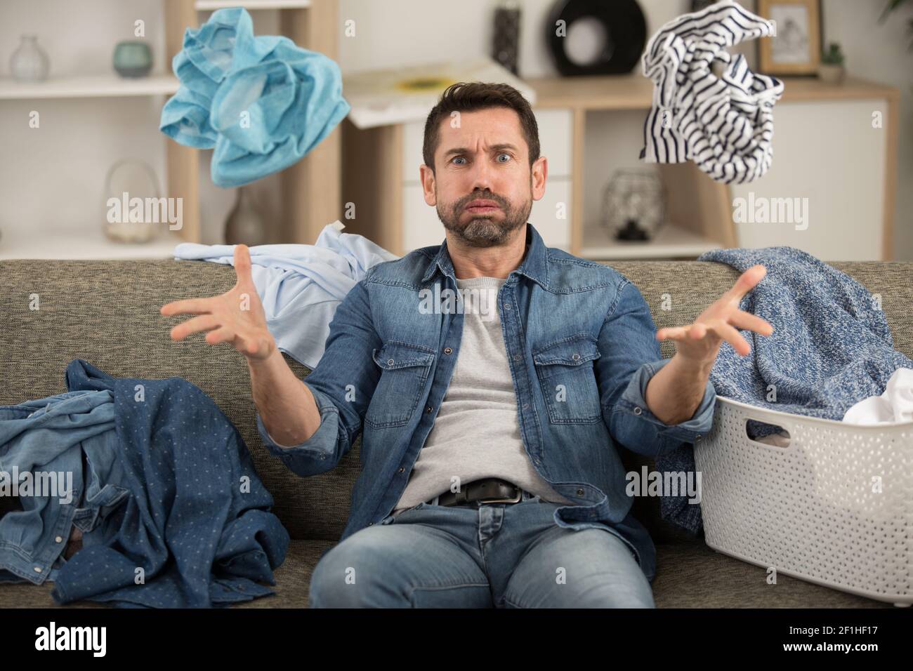 man helpless with dirty clothing after separating from wife Stock Photo -  Alamy